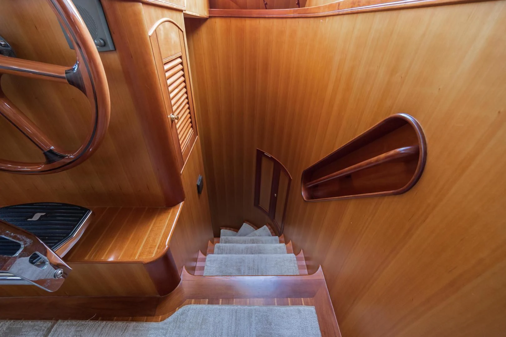 a wooden staircase with a set of stairs aboard DISCONNECTED Yacht for Sale