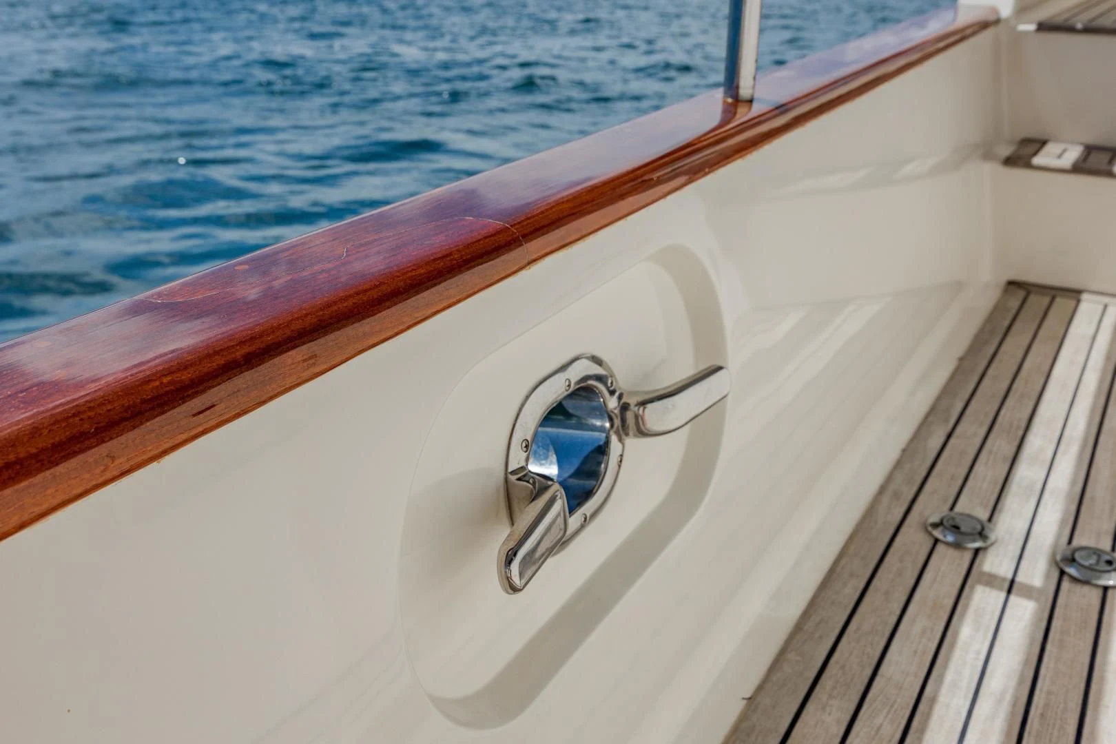 a pair of sunglasses on a wooden boat aboard DISCONNECTED Yacht for Sale