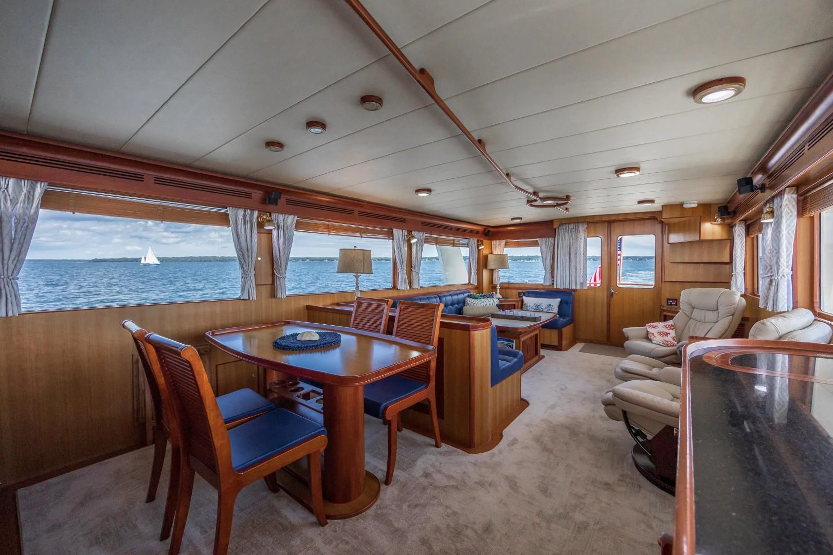 a room with a table and chairs aboard DISCONNECTED Yacht for Sale