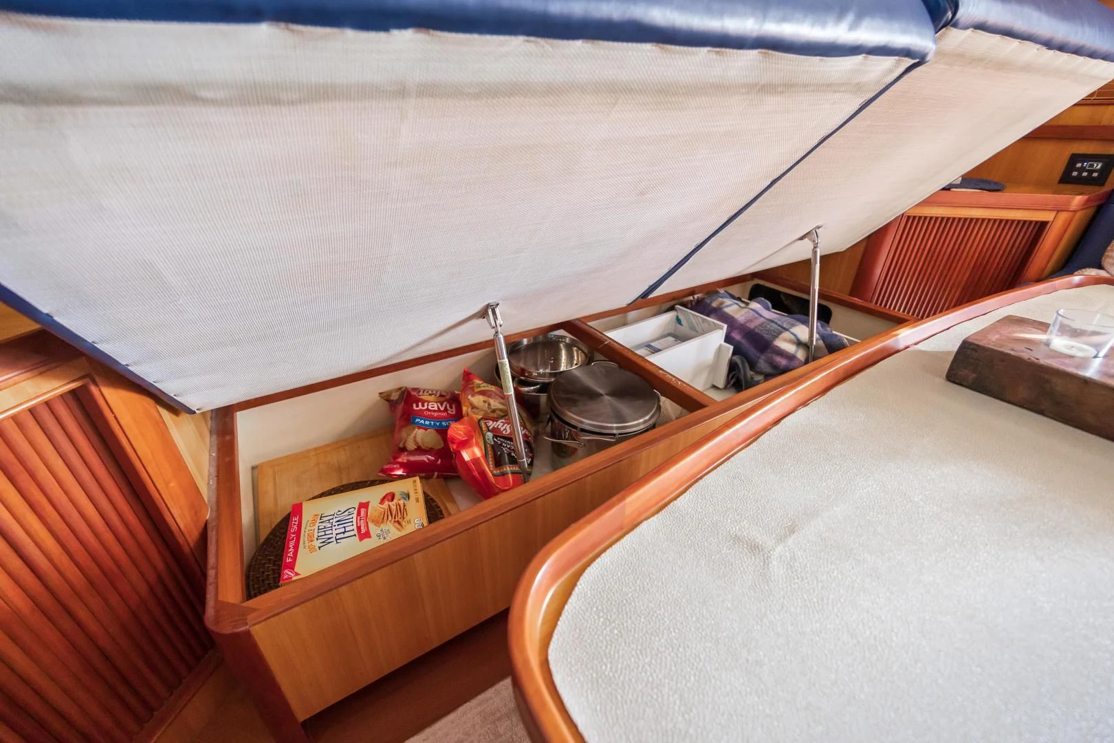 a bunk bed with a shelf and a book shelf aboard DISCONNECTED Yacht for Sale