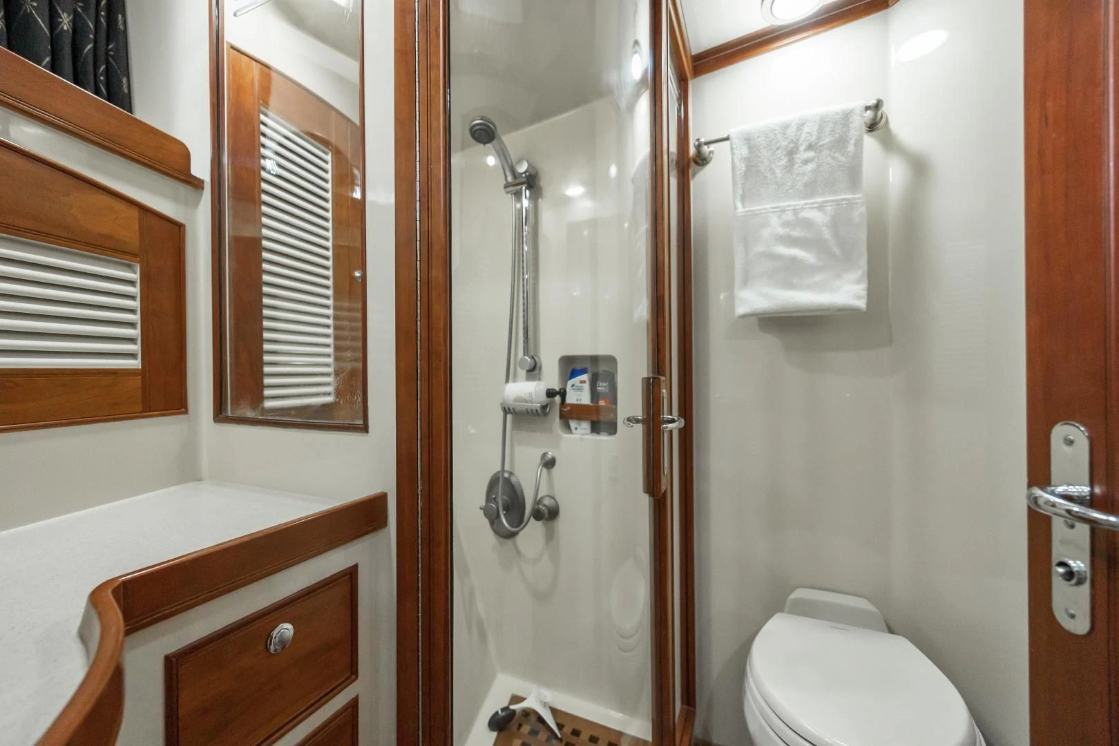 a bathroom with a shower and toilet aboard DISCONNECTED Yacht for Sale