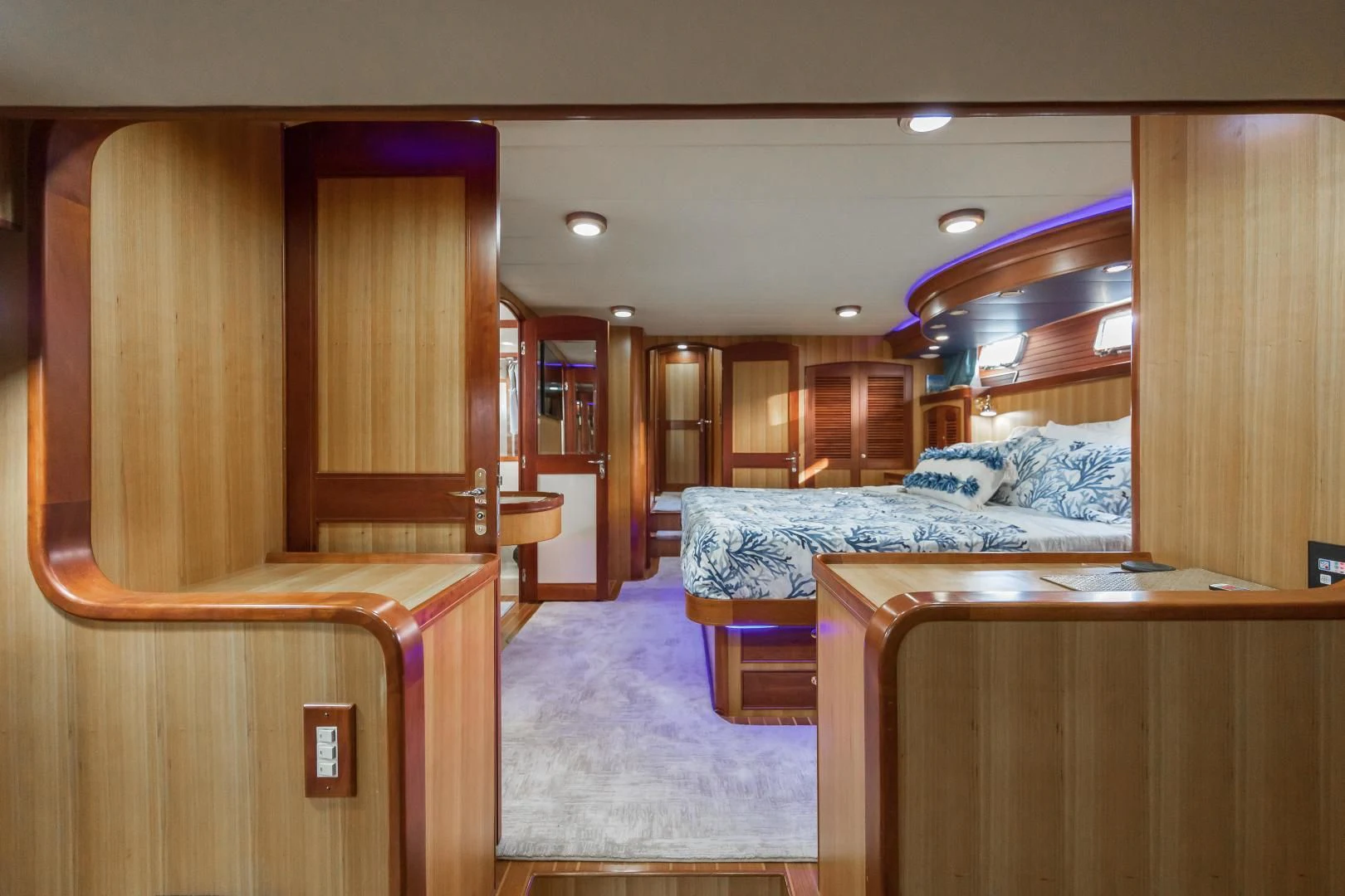a room with a bed and desk aboard DISCONNECTED Yacht for Sale