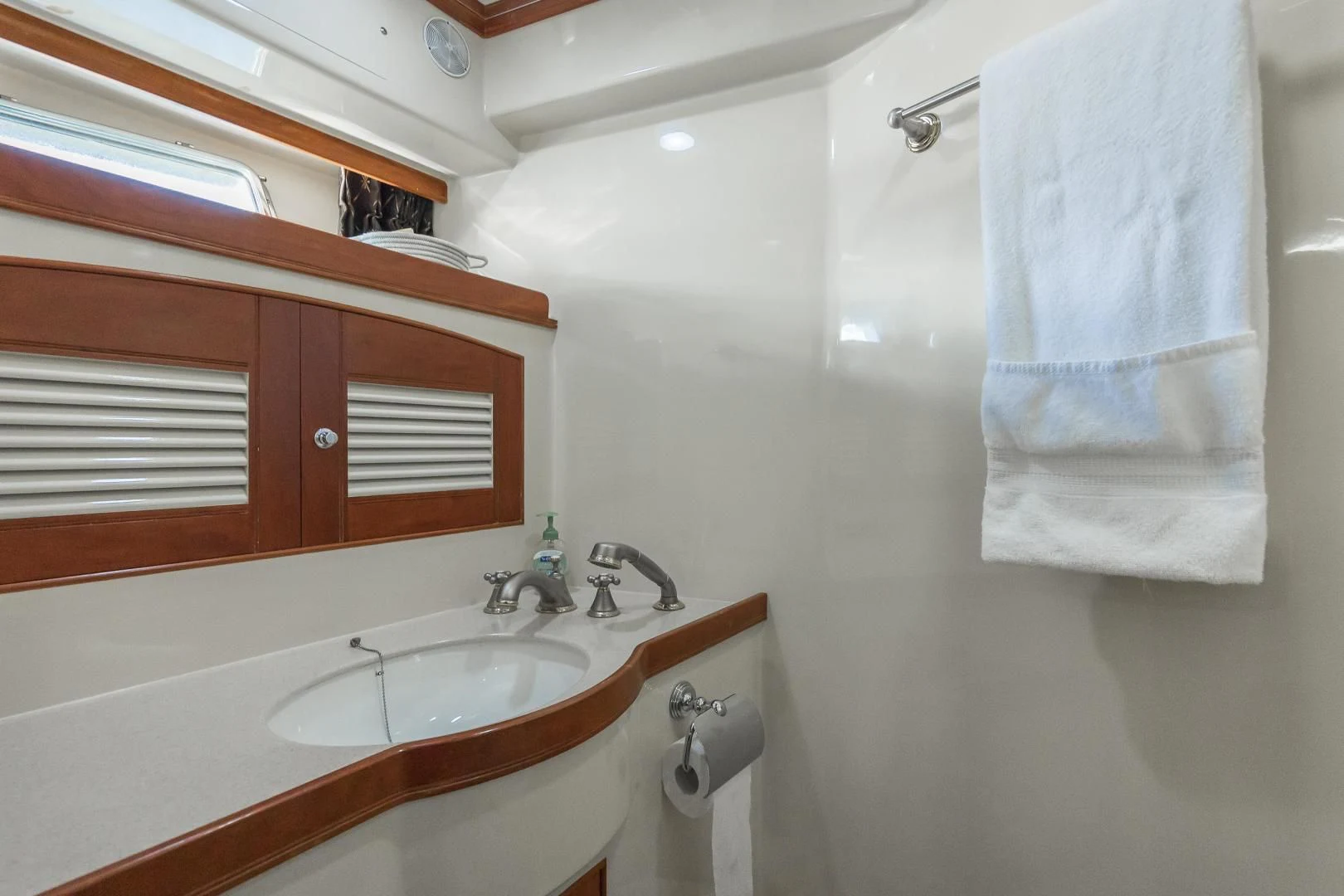 a bathroom with a sink and a mirror aboard DISCONNECTED Yacht for Sale