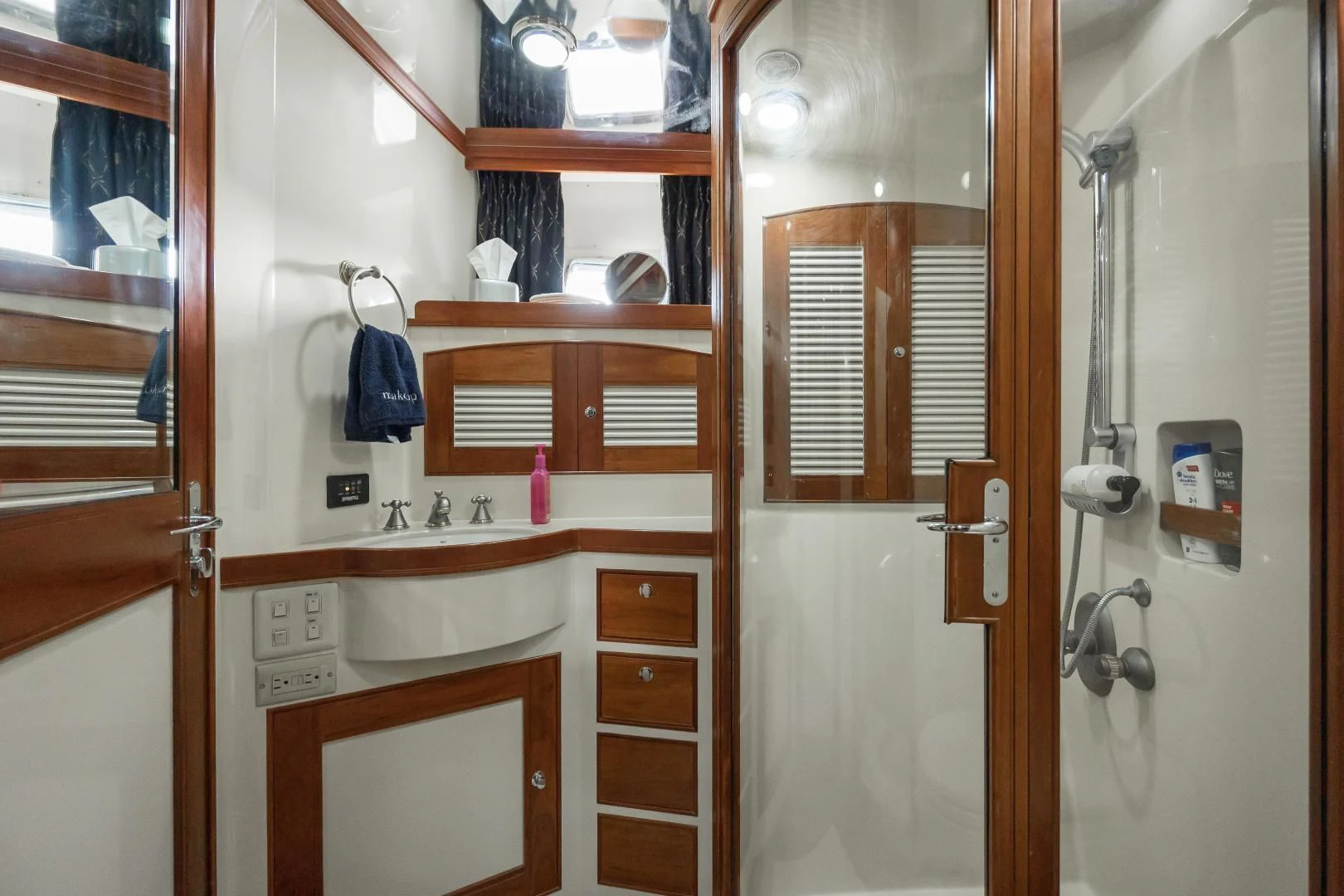 a bathroom with a sink and a mirror aboard DISCONNECTED Yacht for Sale