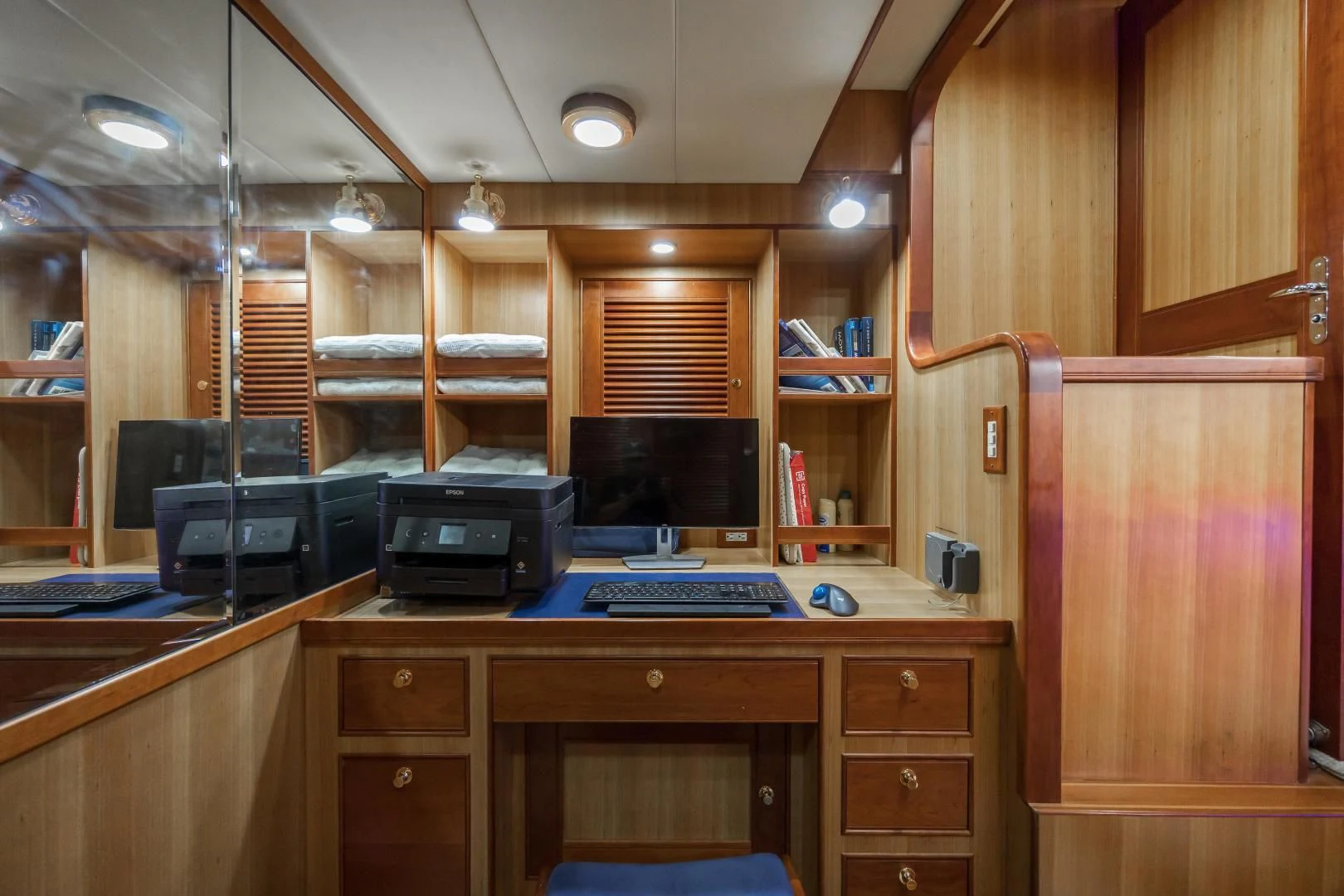 a wood cabinet with a computer on it aboard DISCONNECTED Yacht for Sale