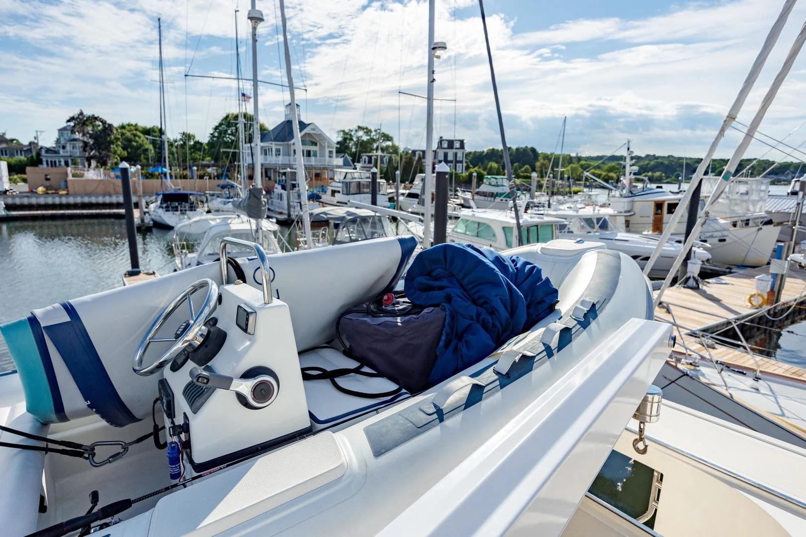 a boat with a blue cover on it aboard DISCONNECTED Yacht for Sale