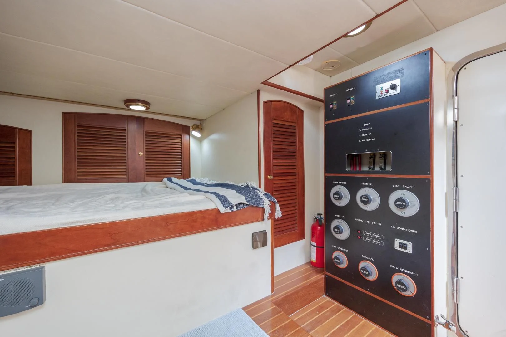 a bedroom with a bed and a television aboard DISCONNECTED Yacht for Sale