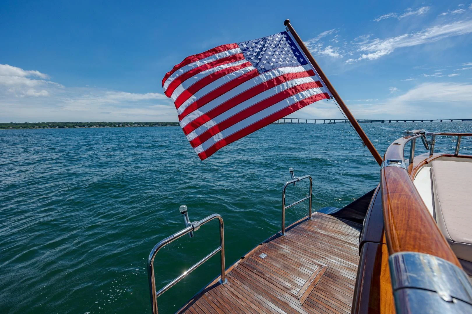 a boat with a flag on it aboard DISCONNECTED Yacht for Sale