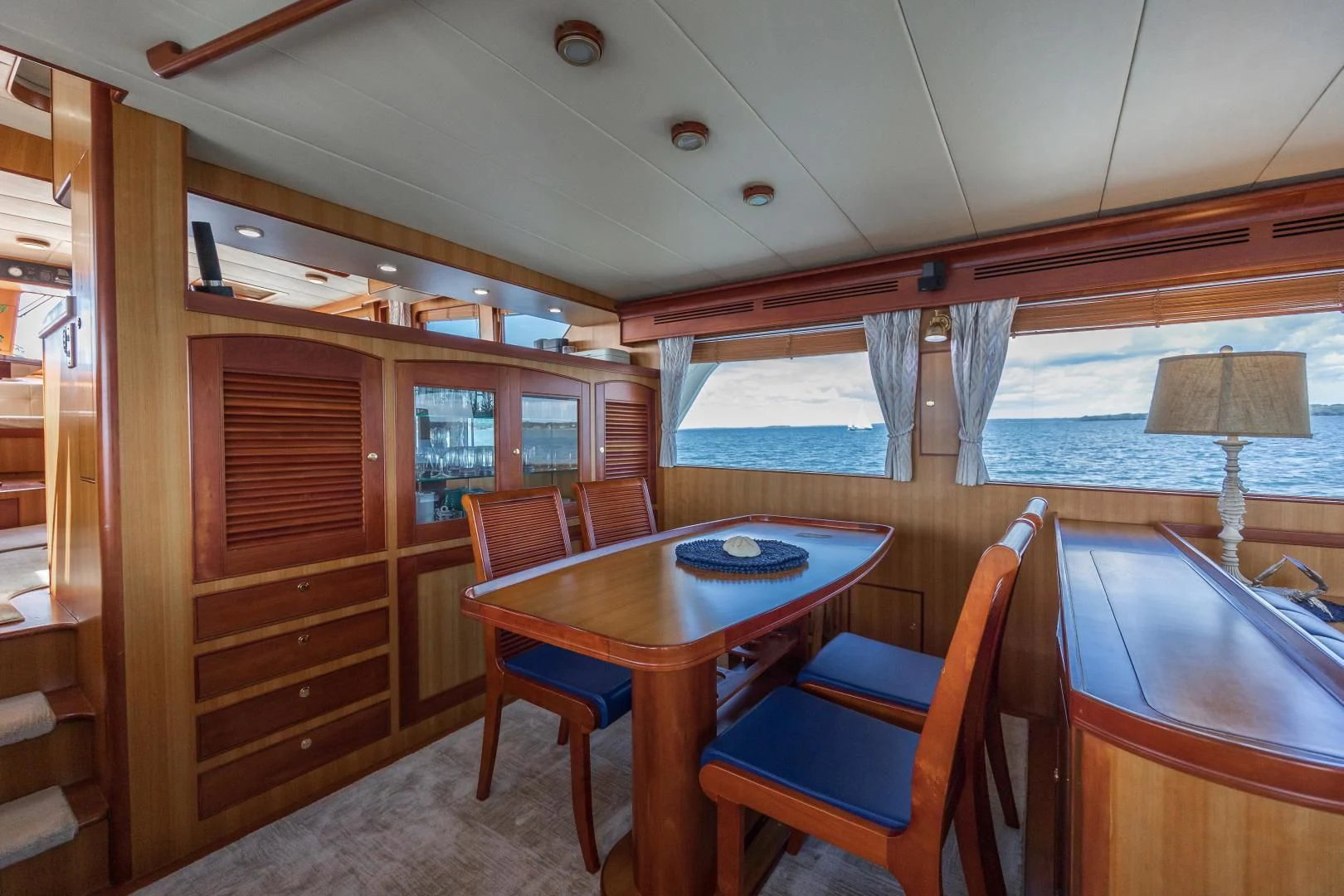 a dining table and chairs in a cabin aboard DISCONNECTED Yacht for Sale