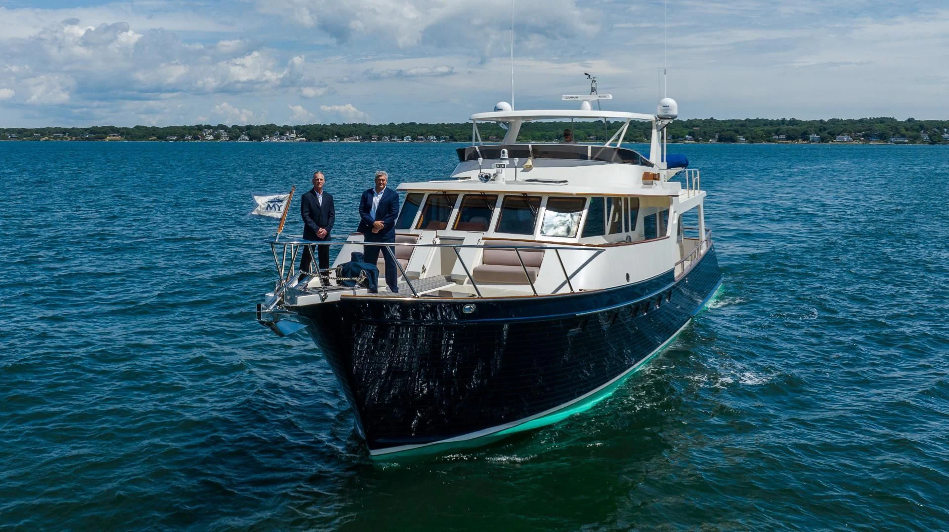 a couple of men on a boat aboard DISCONNECTED Yacht for Sale