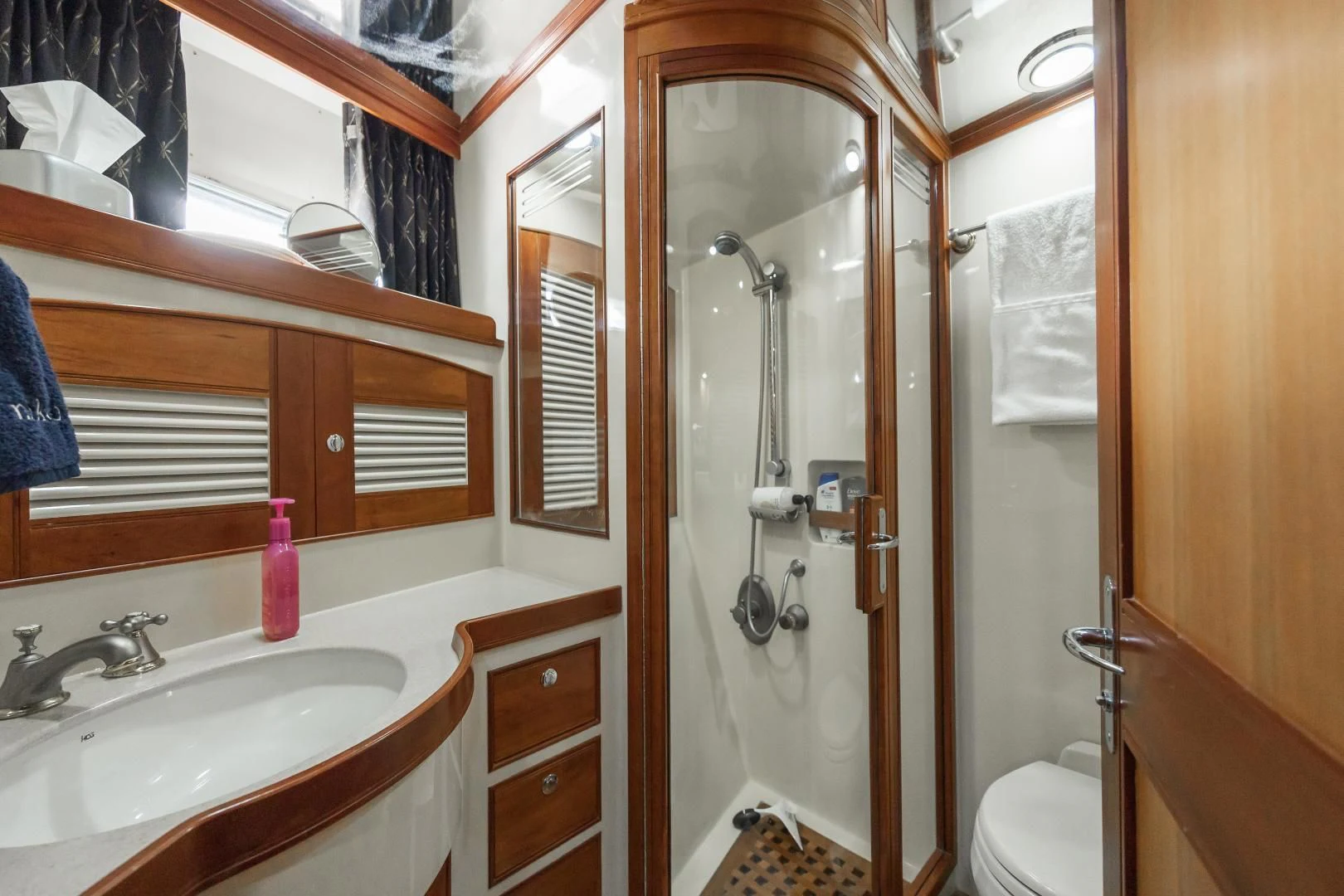 a bathroom with a sink and a toilet aboard DISCONNECTED Yacht for Sale
