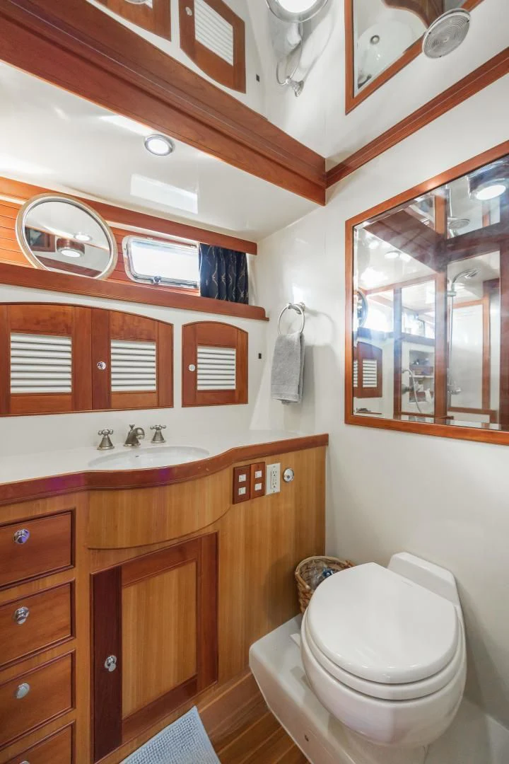 a bathroom with a sink and a toilet aboard DISCONNECTED Yacht for Sale