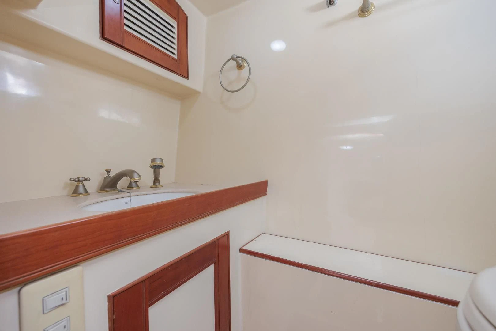 a bathroom with a sink and a mirror aboard DISCONNECTED Yacht for Sale