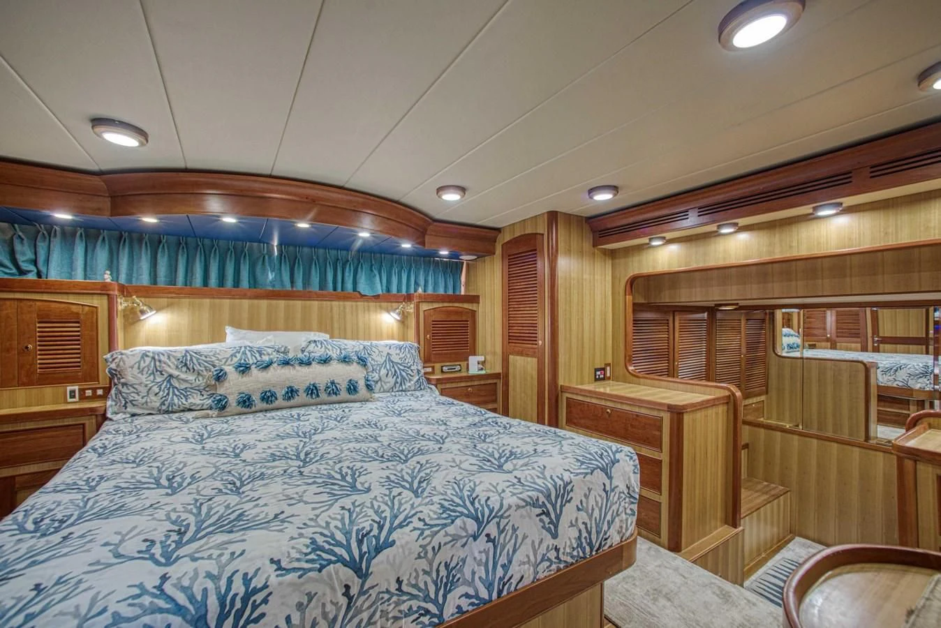 a bedroom with a bed and a desk aboard DISCONNECTED Yacht for Sale