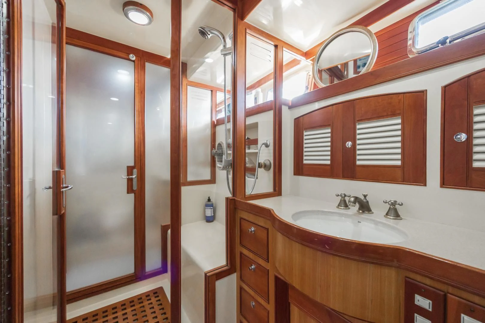 a bathroom with a large mirror aboard DISCONNECTED Yacht for Sale