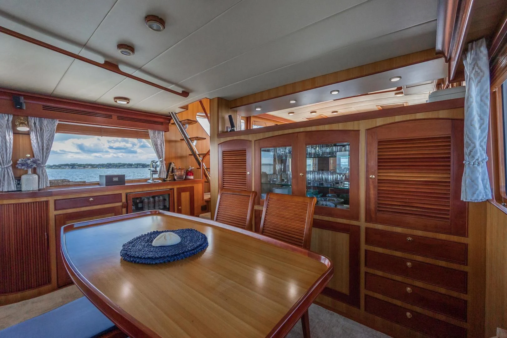 a table and chairs in a room aboard DISCONNECTED Yacht for Sale