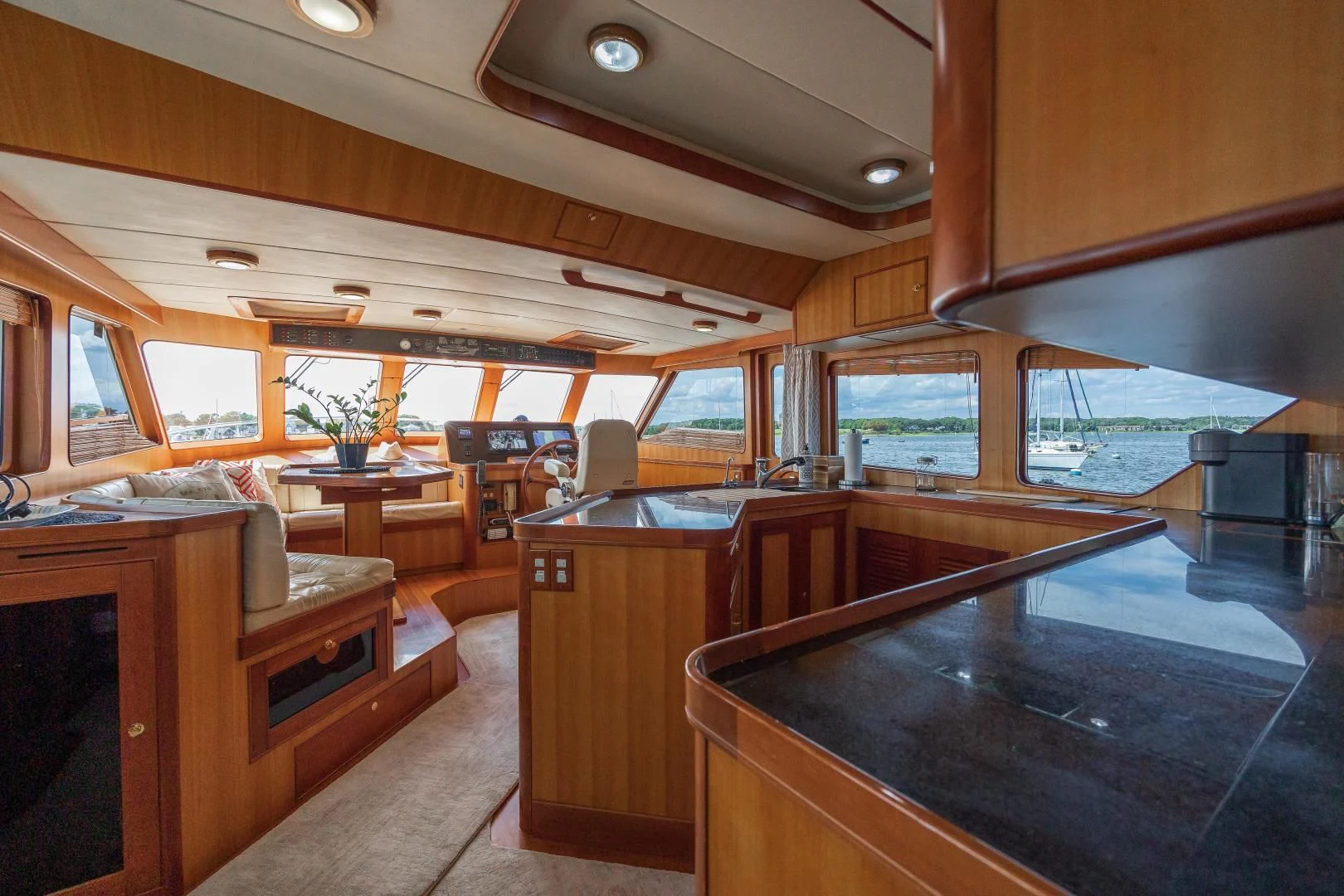 inside of a building with a large window and a pool table aboard DISCONNECTED Yacht for Sale