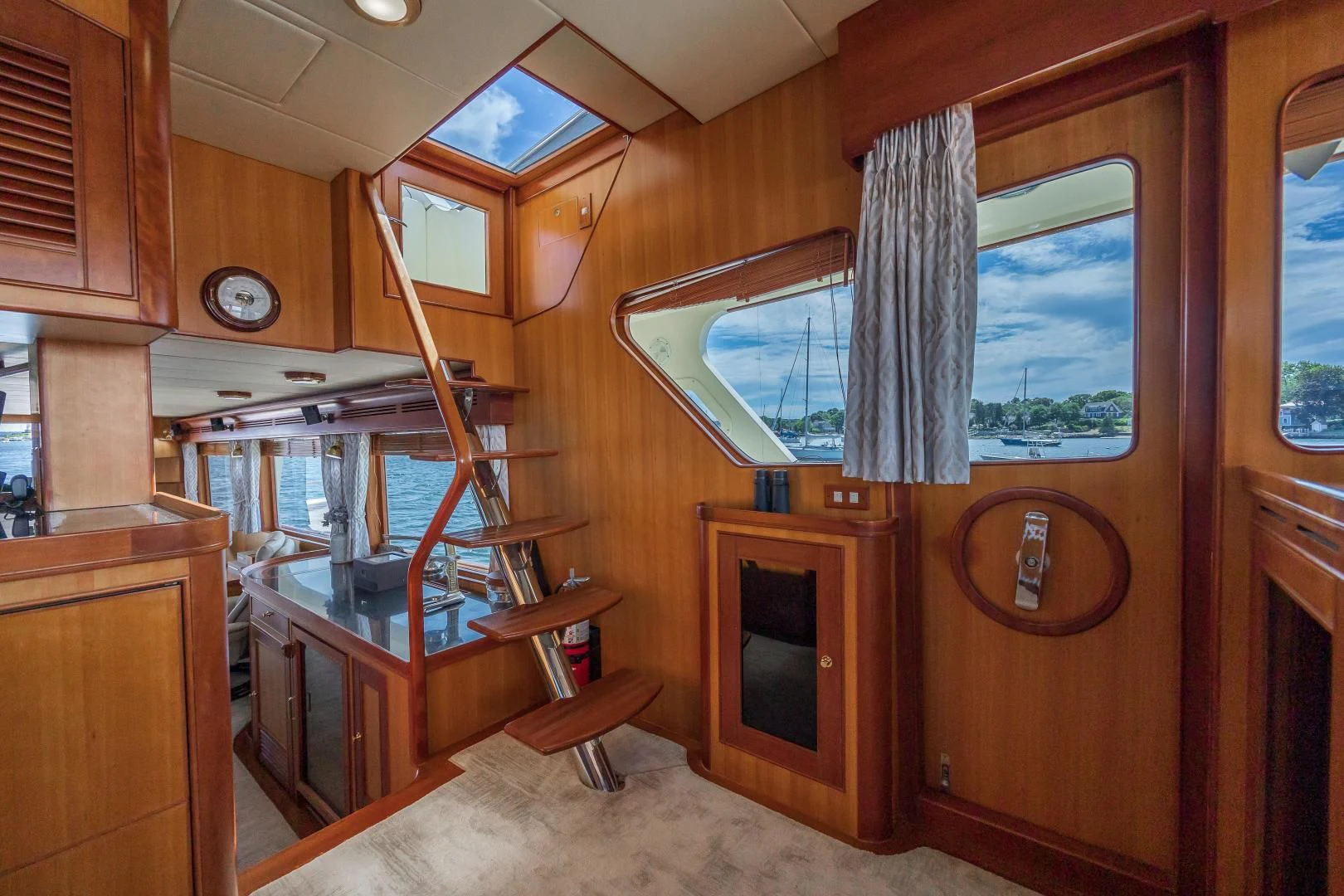a wooden cabin with a large window aboard DISCONNECTED Yacht for Sale