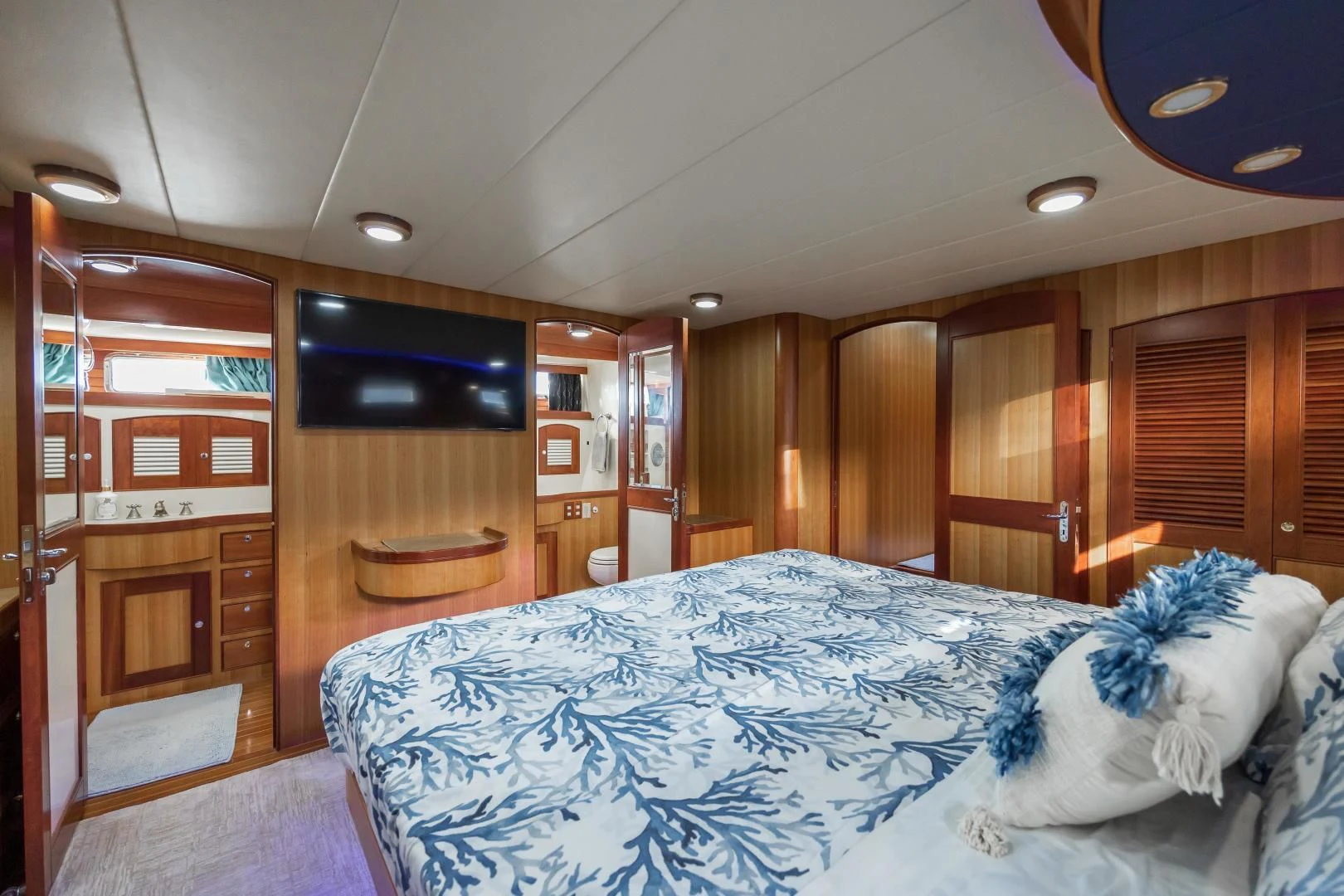 a bedroom with a large bed aboard DISCONNECTED Yacht for Sale