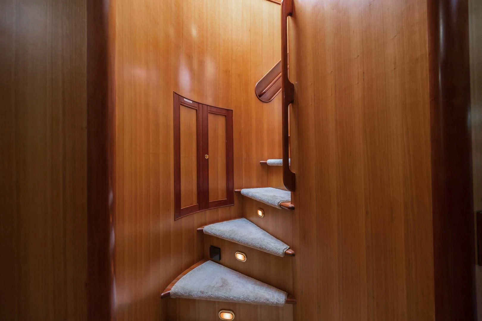 a wooden door with a chair and a bench aboard DISCONNECTED Yacht for Sale