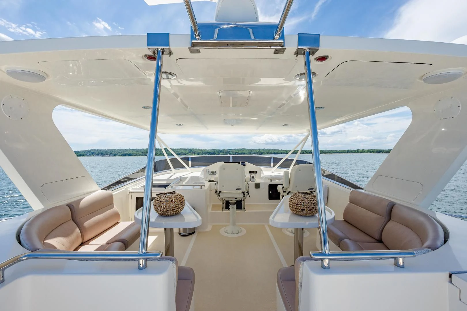 a boat with a chair and a table on the deck aboard DISCONNECTED Yacht for Sale