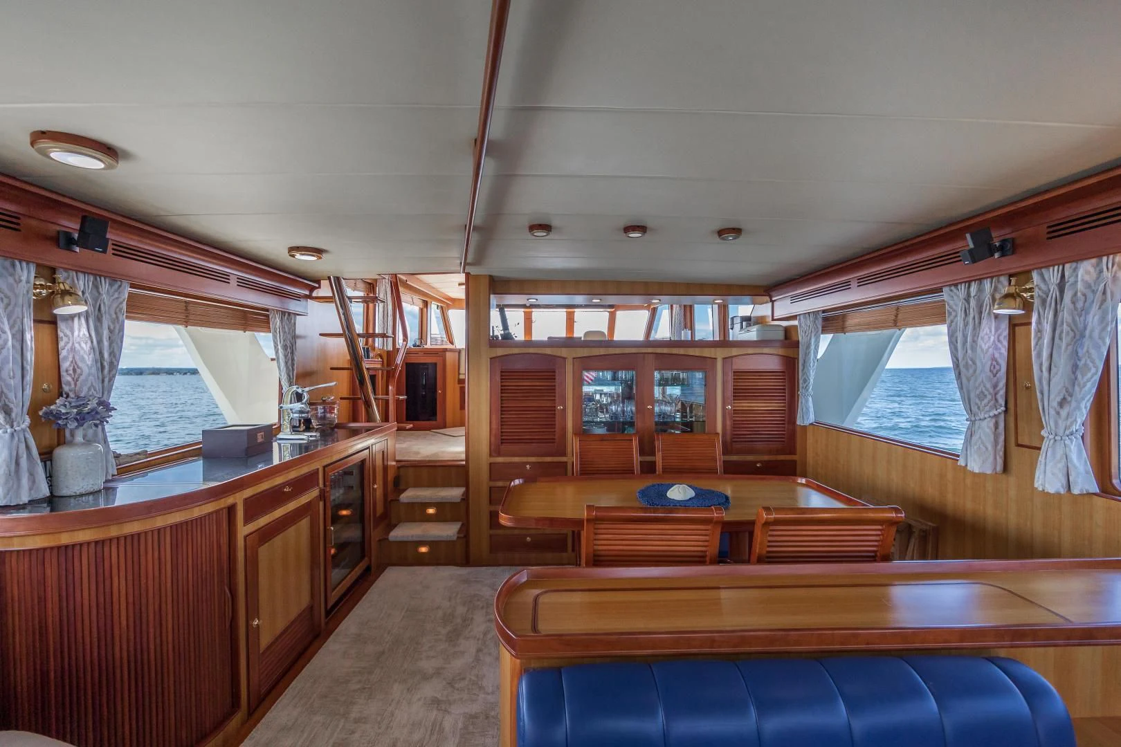 a large kitchen with wooden cabinets aboard DISCONNECTED Yacht for Sale