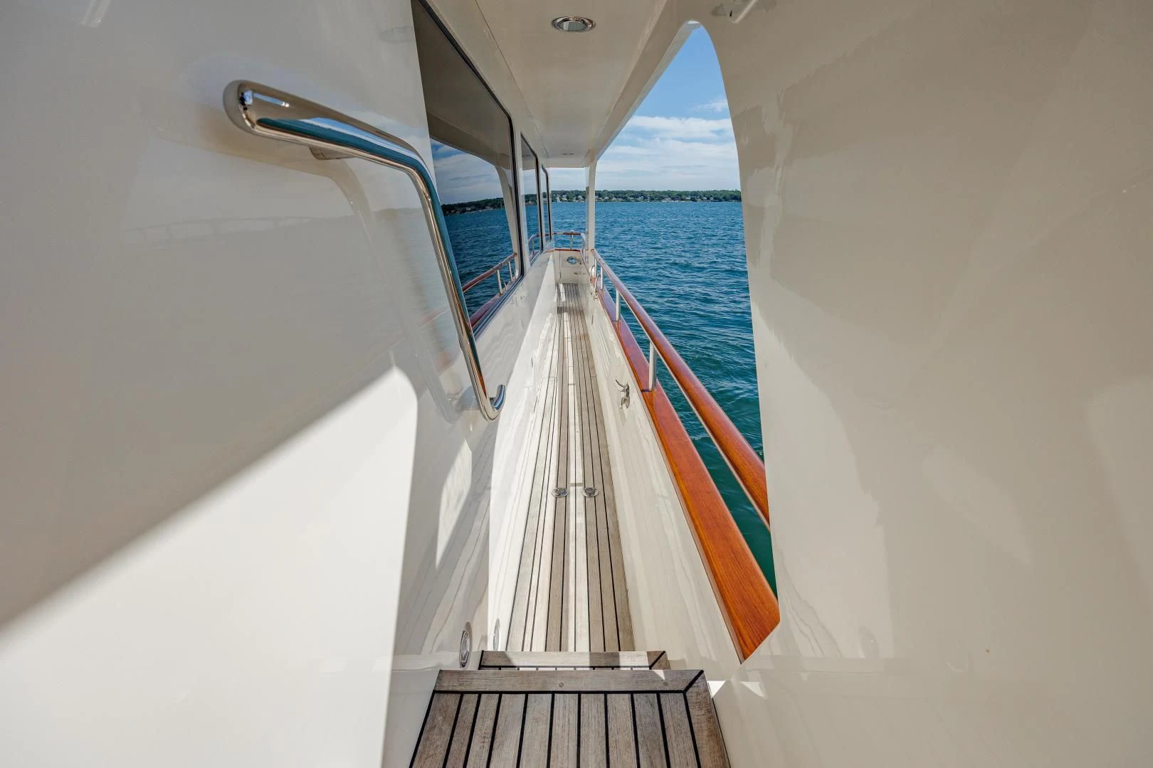 a white boat with a ladder aboard DISCONNECTED Yacht for Sale