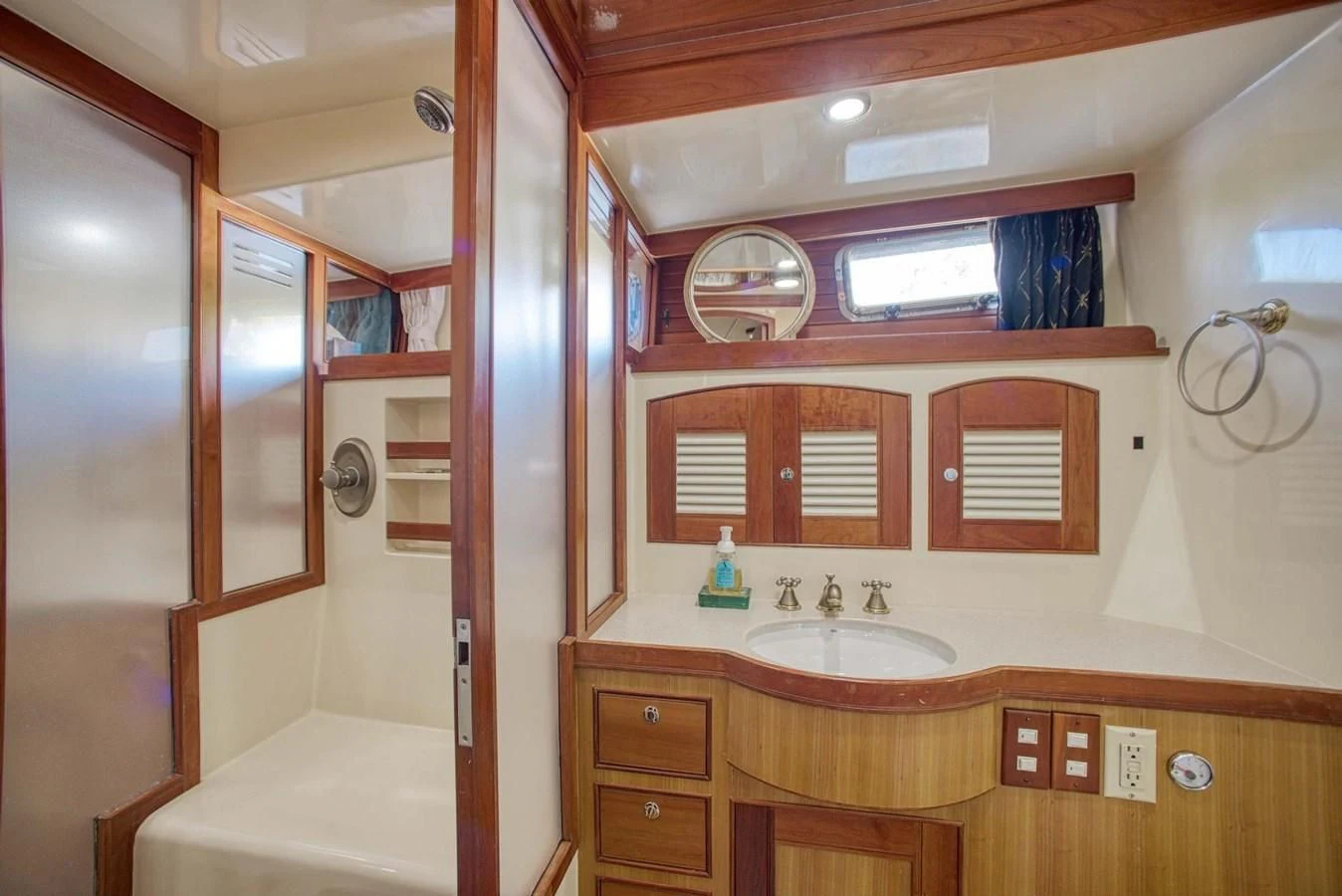 a bathroom with a sink and a mirror aboard DISCONNECTED Yacht for Sale