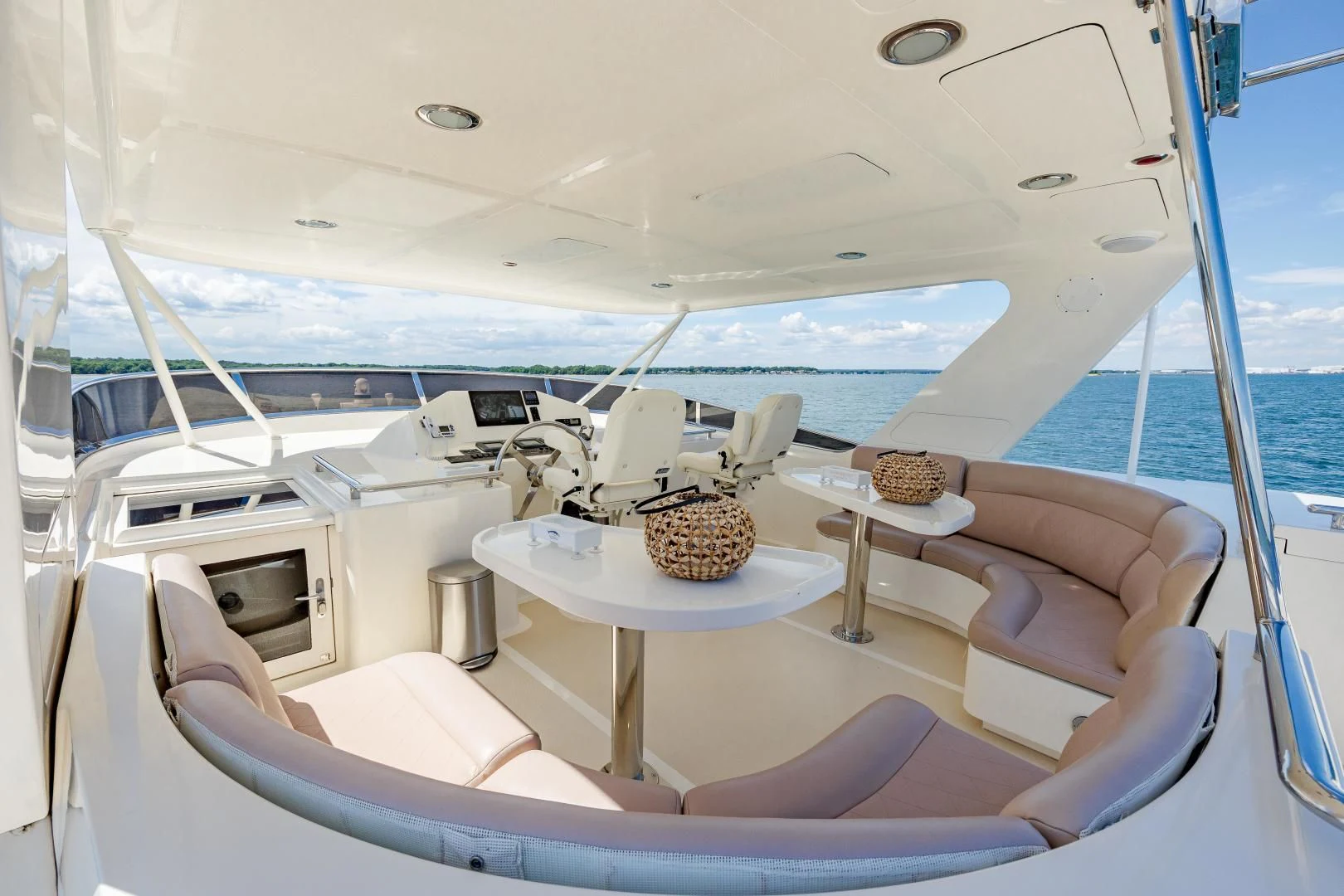 a boat with a table and chairs aboard DISCONNECTED Yacht for Sale