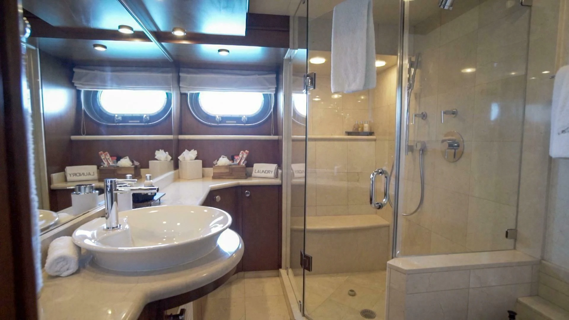 a bathroom with a glass shower aboard AT LAST Yacht for Charter