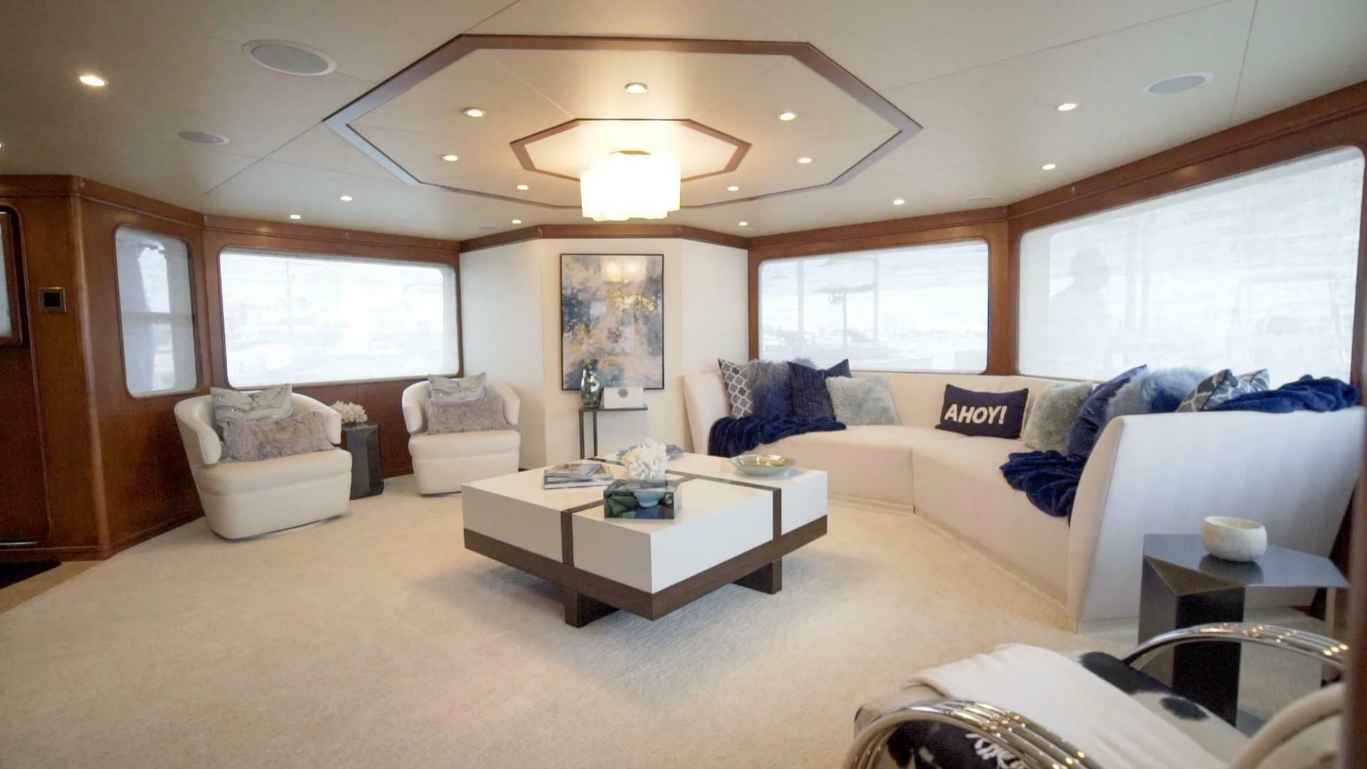 a living room with a couch and a table aboard AT LAST Yacht for Charter