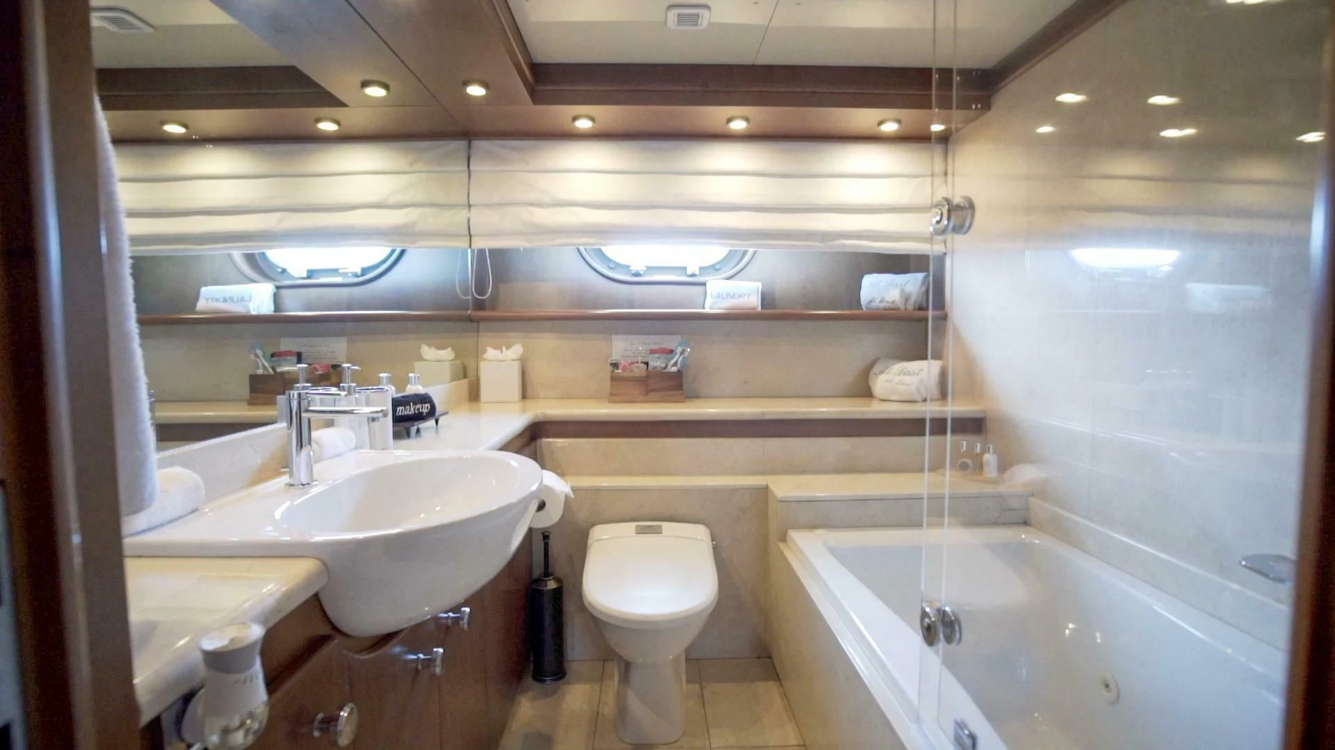 a bathroom with a glass shower aboard AT LAST Yacht for Charter