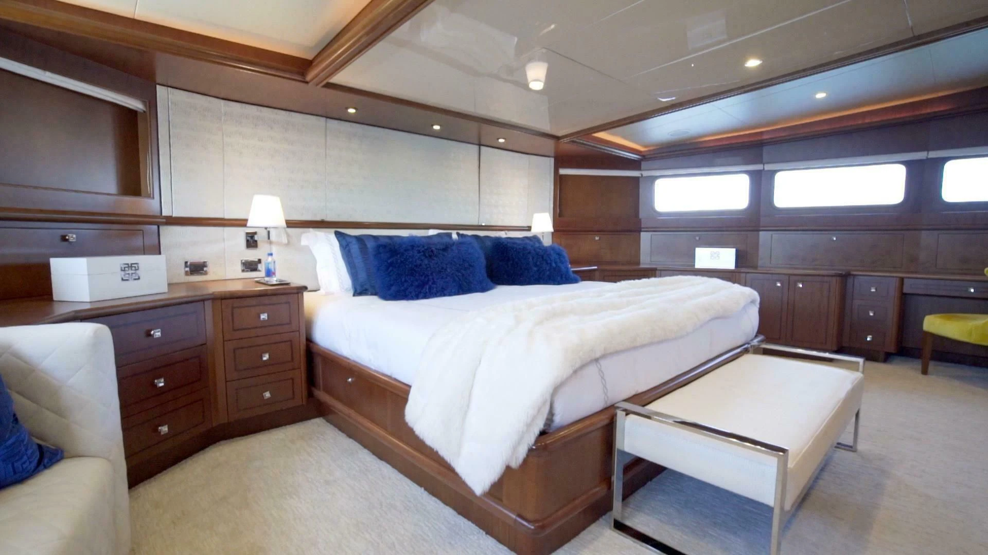 a room with a bed and a table aboard AT LAST Yacht for Charter
