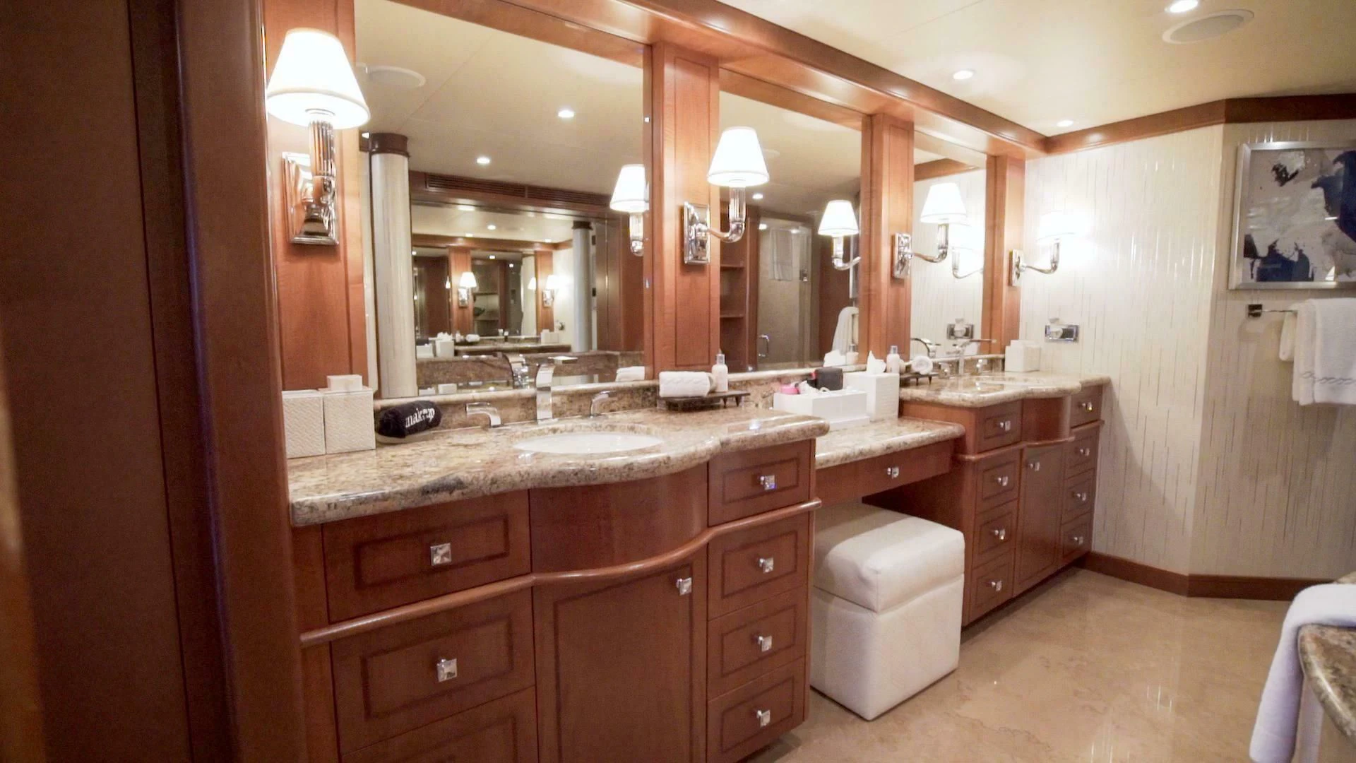 a bathroom with a large mirror aboard AT LAST Yacht for Charter