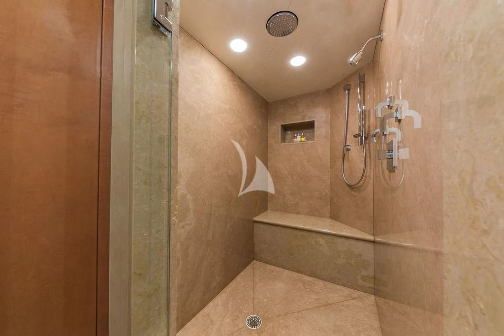 a bathroom with a shower unit aboard AT LAST Yacht for Charter