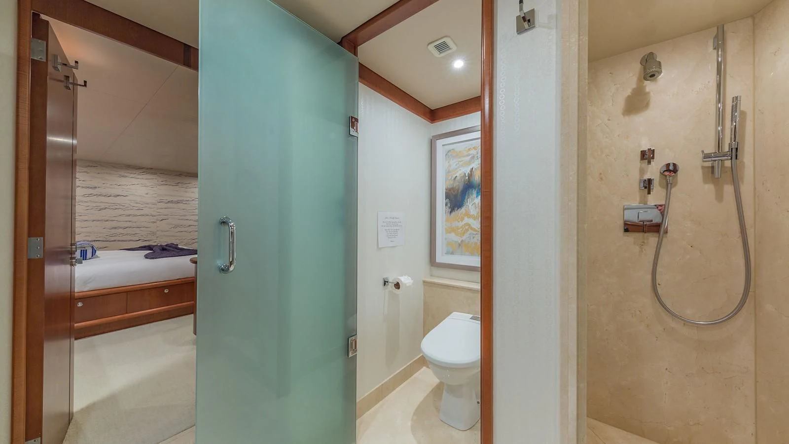 a bathroom with a shower and toilet aboard AT LAST Yacht for Charter