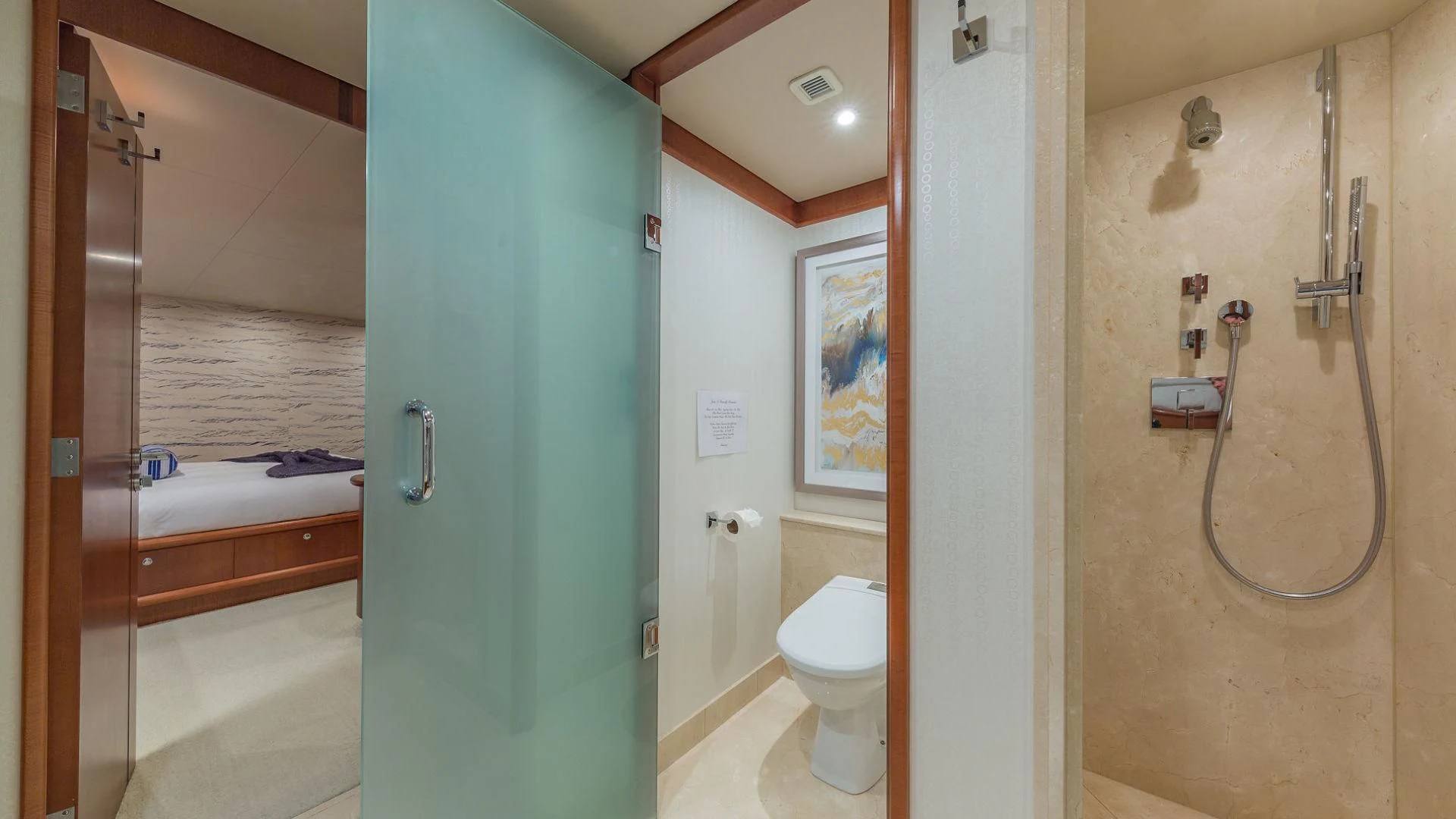 a bathroom with a shower and toilet aboard AT LAST Yacht for Charter