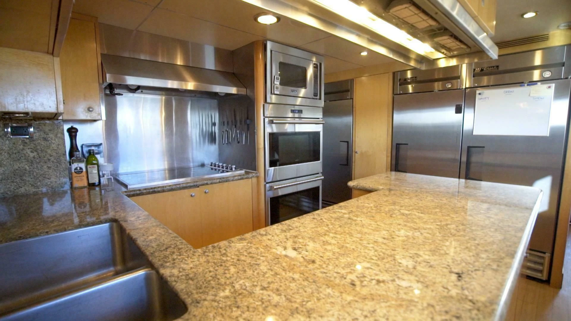 a kitchen with stainless steel appliances aboard AT LAST Yacht for Charter