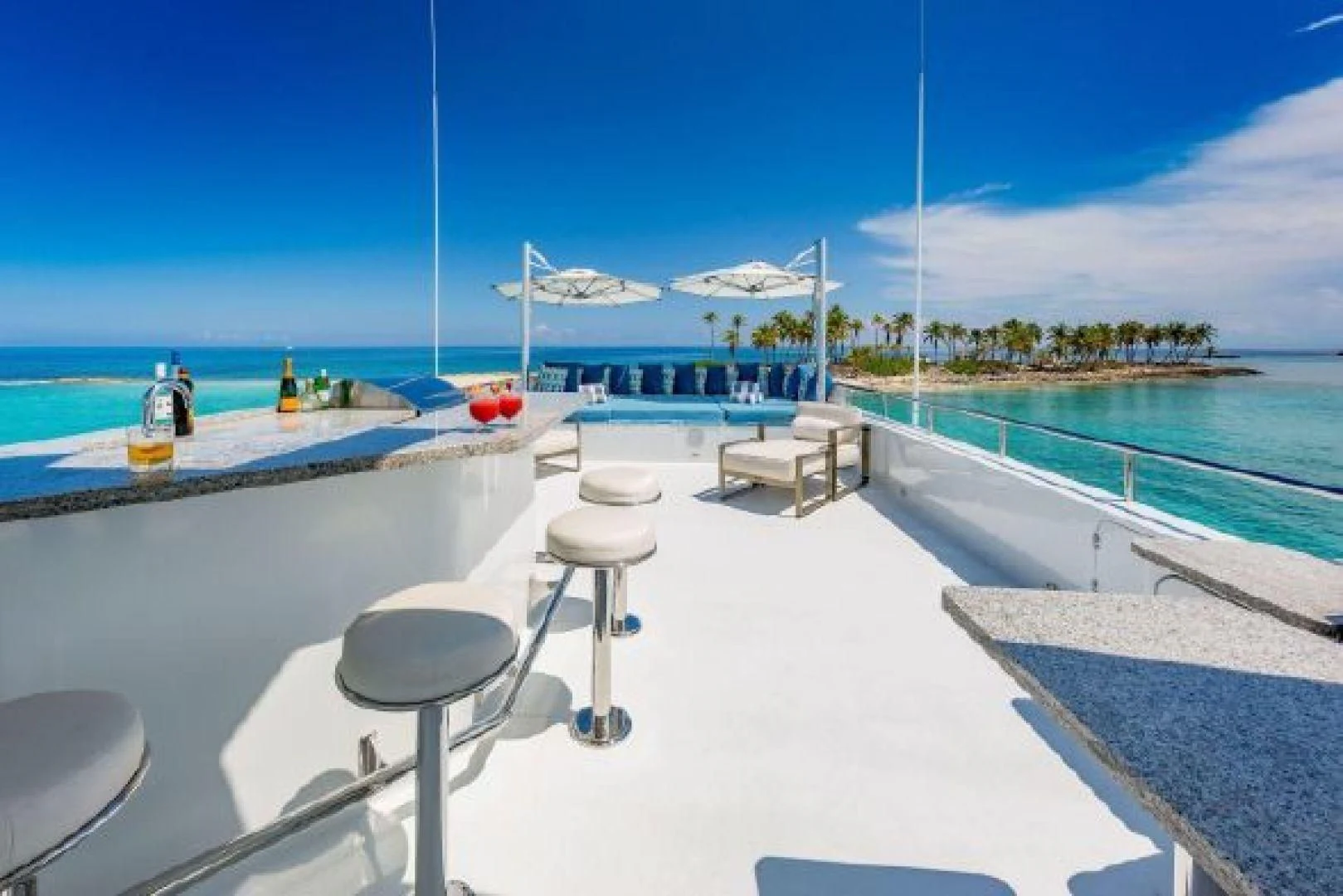 a pool with a table and chairs aboard AT LAST Yacht for Charter