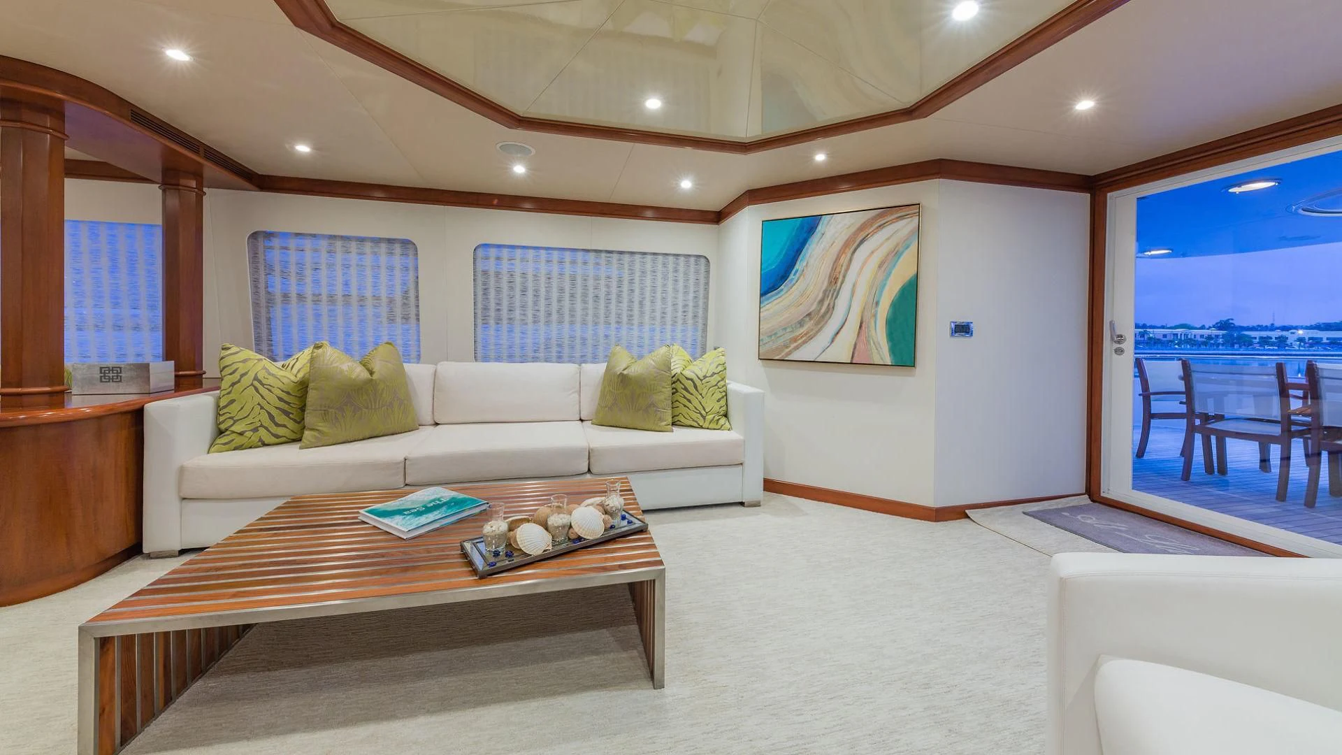 a living room with a large window aboard AT LAST Yacht for Charter