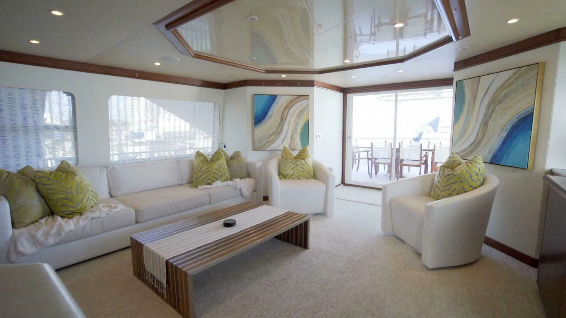 a living room with a couch and a table aboard AT LAST Yacht for Charter