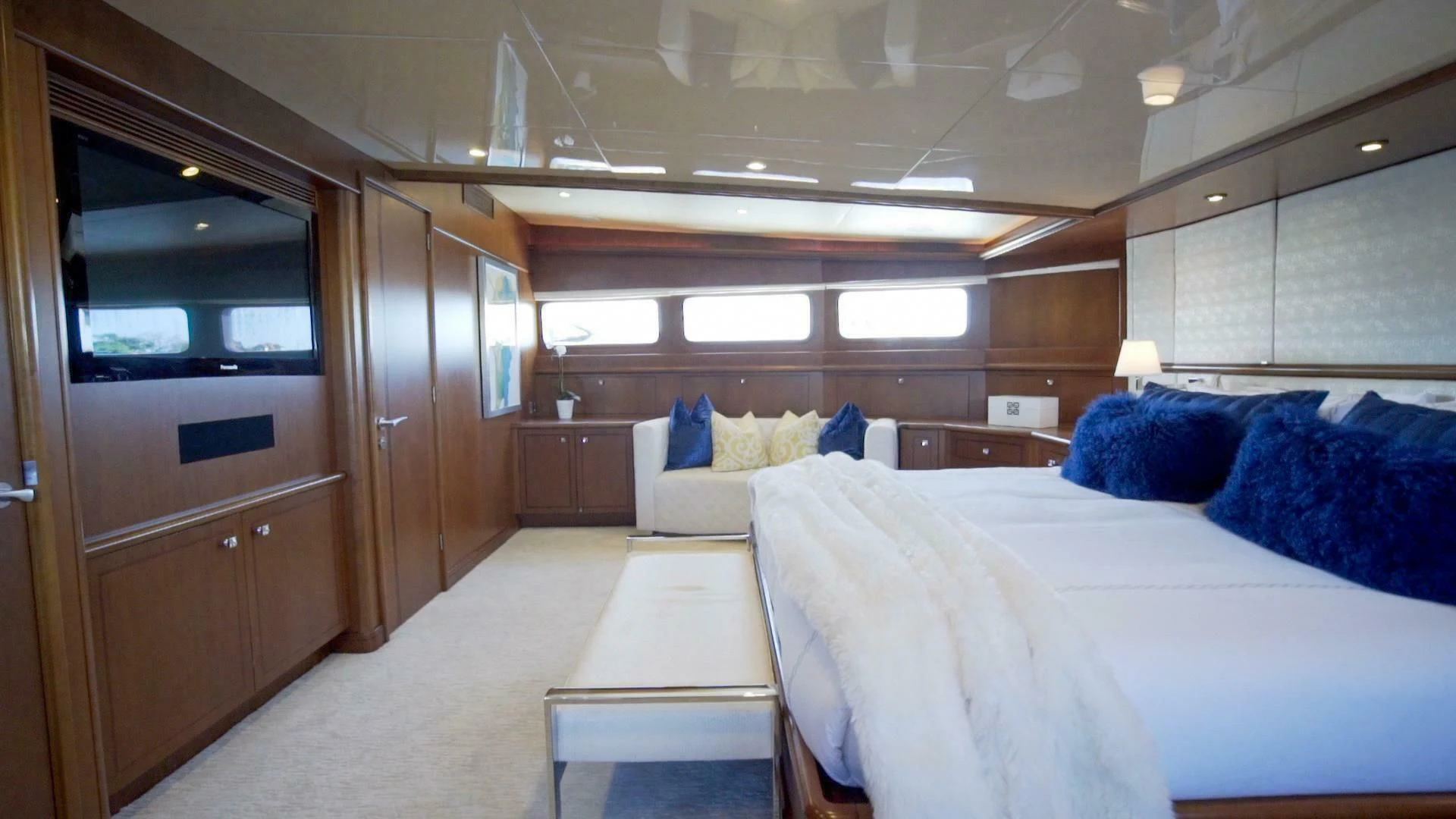 a room with a bed and a desk aboard AT LAST Yacht for Charter