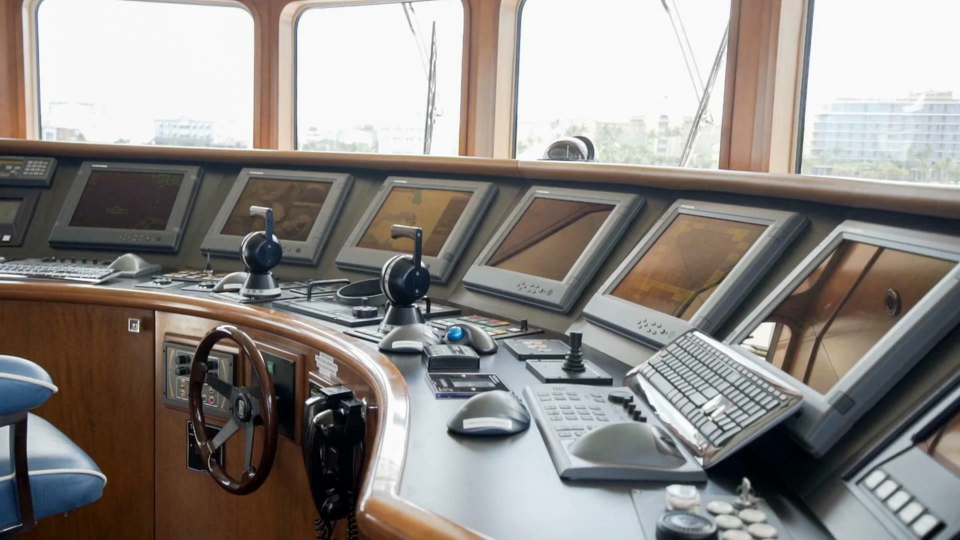 a desk with a computer and other office equipment aboard AT LAST Yacht for Charter