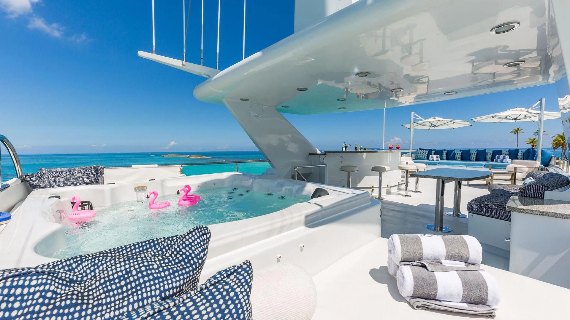 a large white swimming pool aboard AT LAST Yacht for Charter