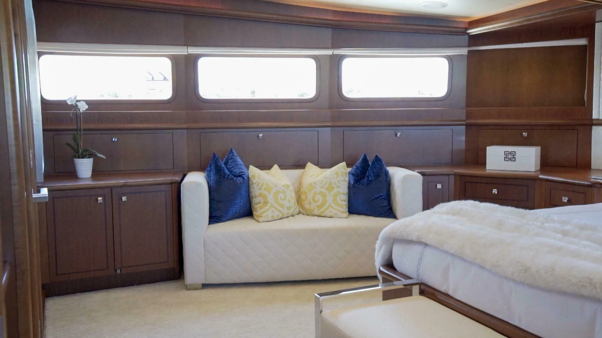 a room with a bed and a desk aboard AT LAST Yacht for Charter