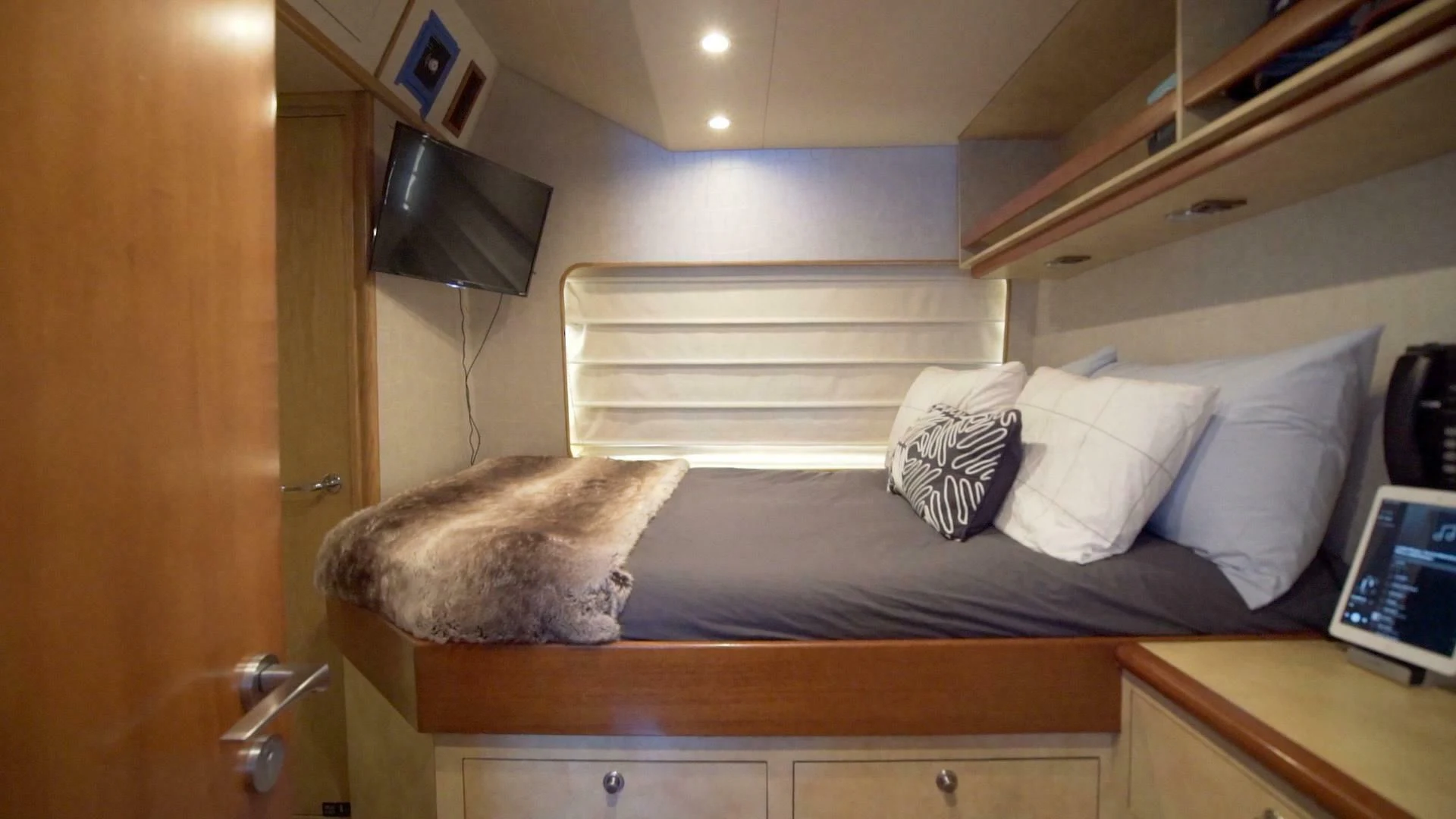 a cat lying on a bed aboard AT LAST Yacht for Charter