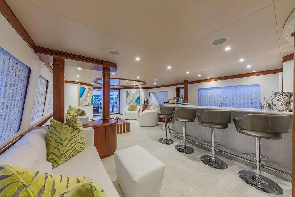 a room with a couch and a television aboard AT LAST Yacht for Charter