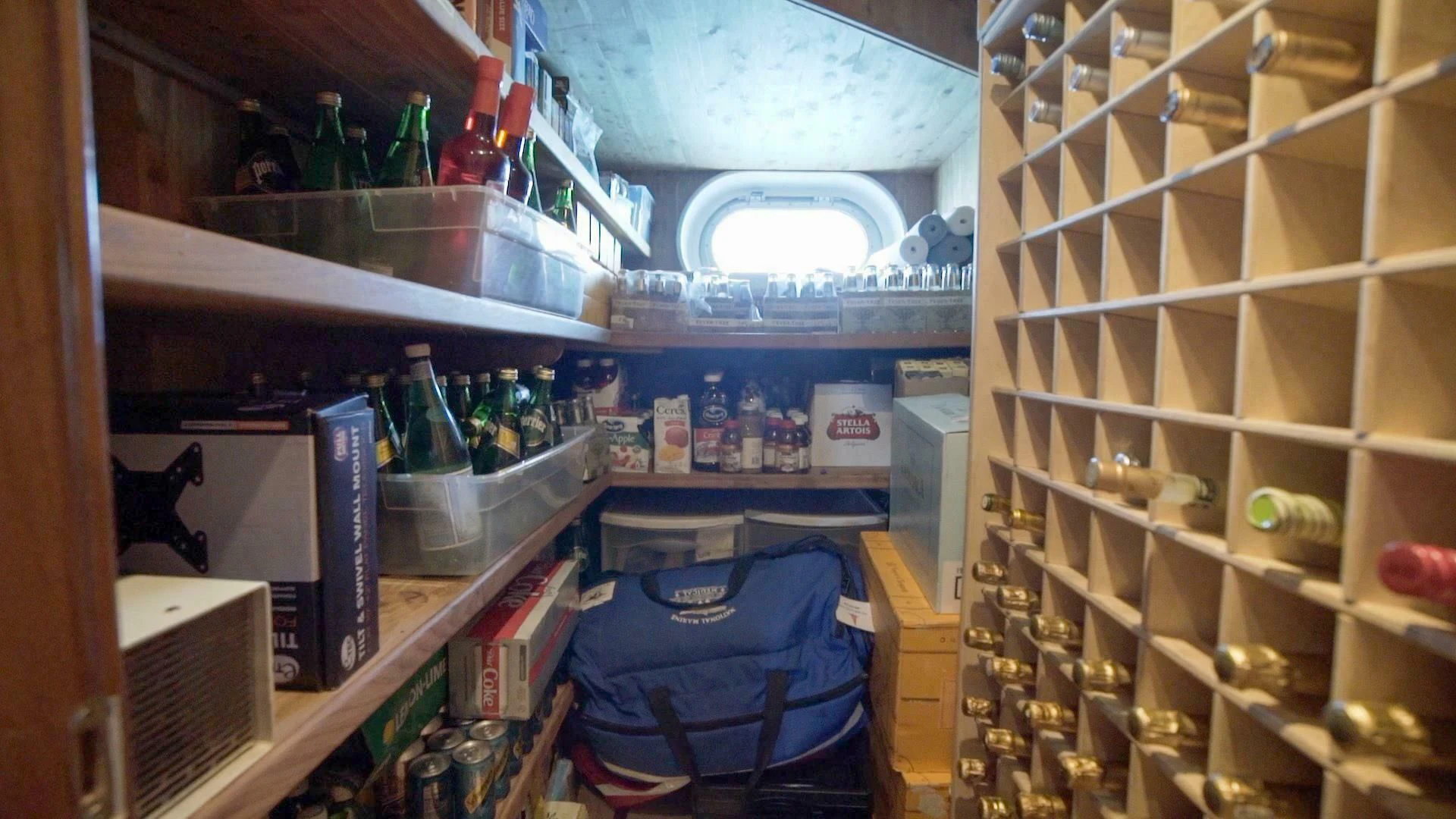 a kitchen with a blue bag and a blue bag in a refrigerator aboard AT LAST Yacht for Charter