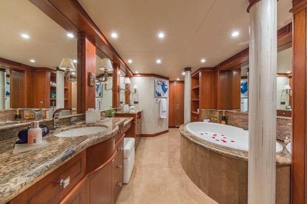 a bathroom with a large tub aboard AT LAST Yacht for Charter