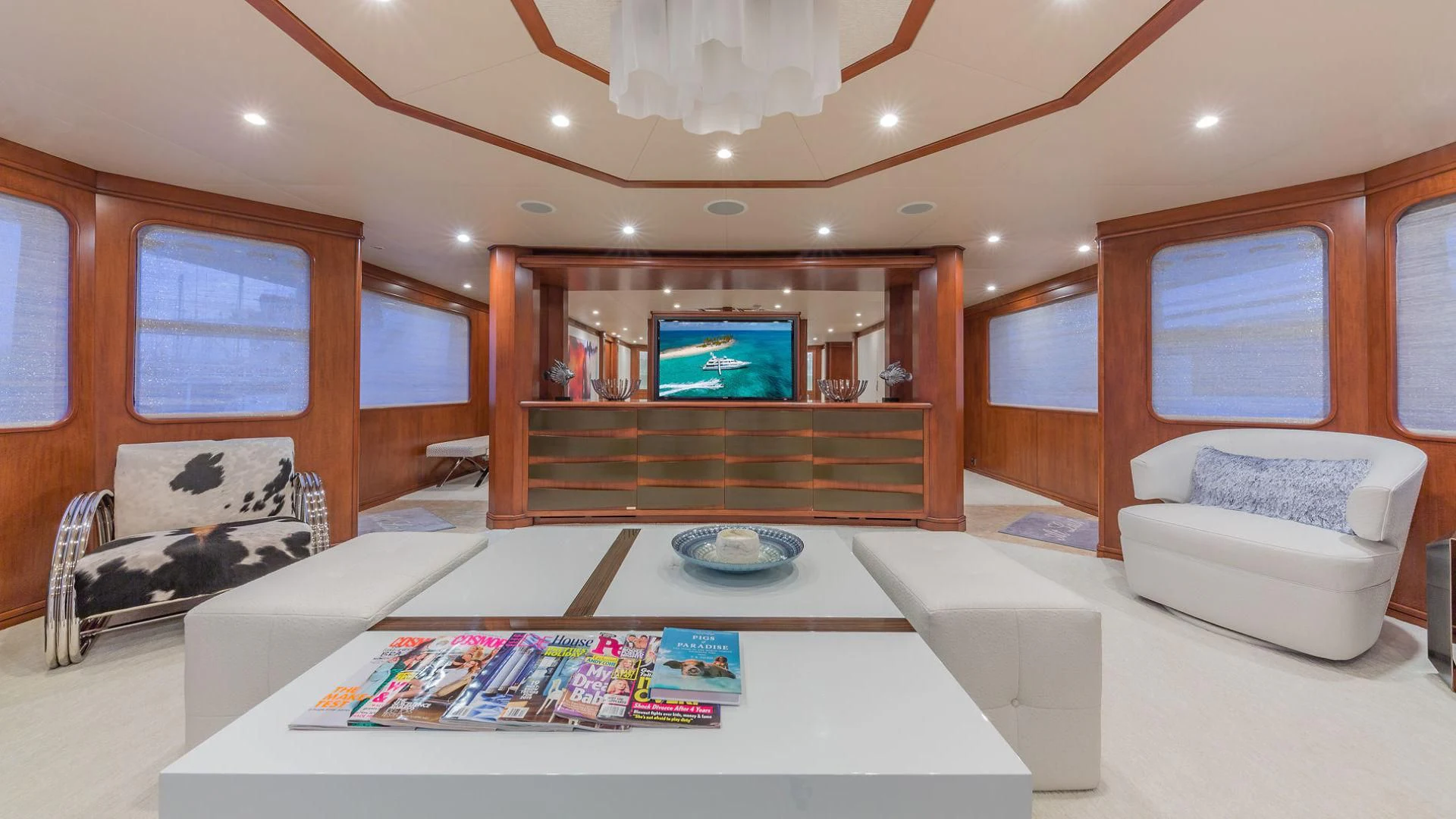 a living room with a large tv aboard AT LAST Yacht for Charter